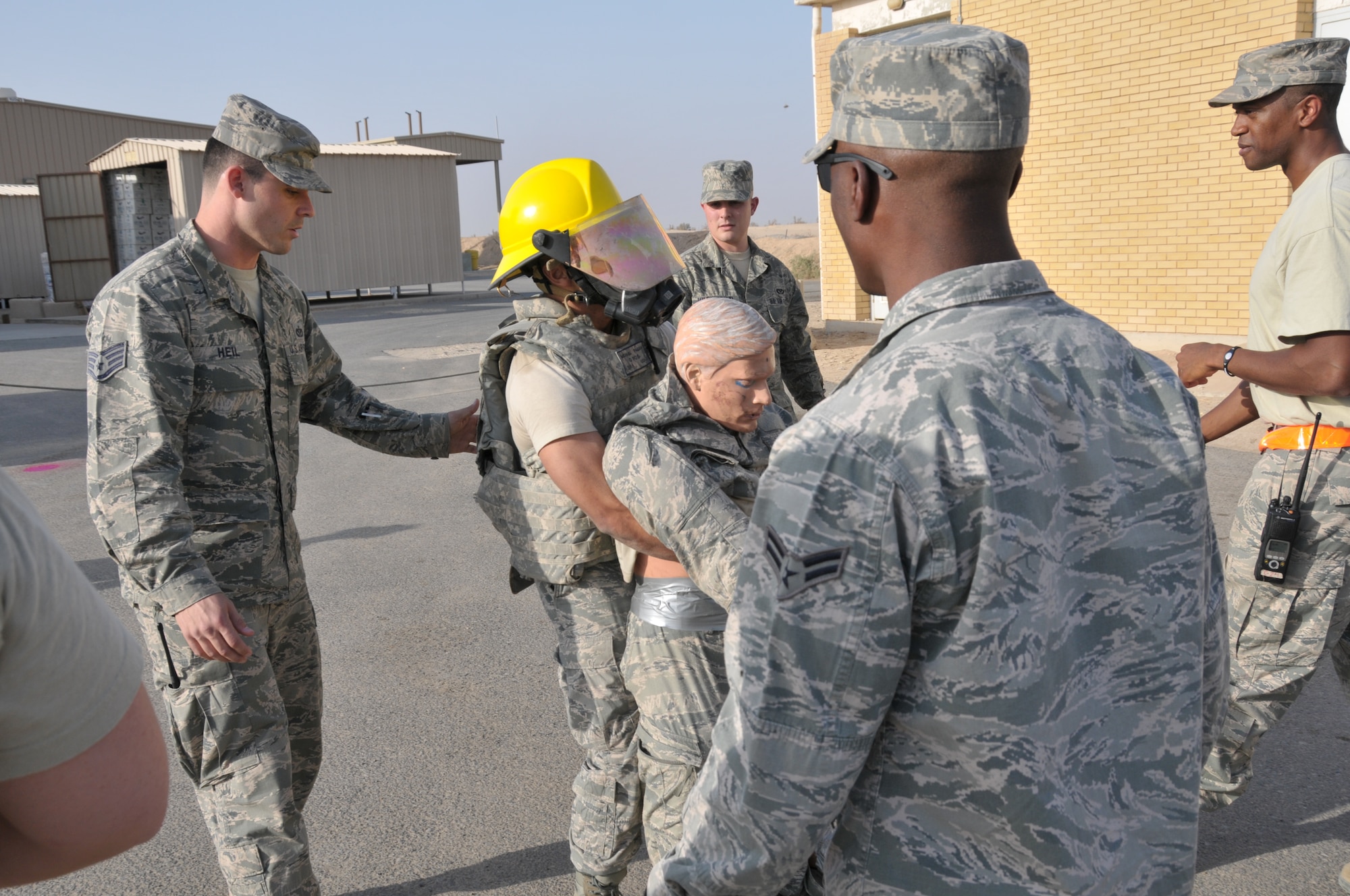 Senior Airman Michael Pagan, 332nd Expeditionary Civil Engineer Squadron firefighter, drags a 185-pound mannequin during a firefighter challenge at an undisclosed location in Southwest Asia Nov. 11, 2011. Pagan who is from Lewisberry, Pa., and is deployed from Joint Base McGuire-Dix-Lakehurst, N.J., participated in the challenge to commemorate Veterans Day. (U.S. Air Force photo by Master Sgt. Paul Mann)
