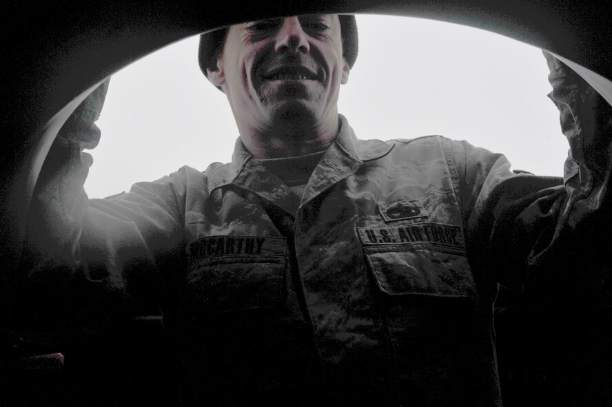 Tech. Sgt. Keith McCarthy, 838th Air Expeditionary Advisory Group, Detachment 1, maintenance air adviser climbs atop an Mi-17 helicopter during preflight checks before a training flight over Herat City, Afghanistan, Nov. 10, 2011.The 838th AEAG Airmen advise Afghan soldiers on the maintenance, operations, and security of the Mi-17 helicopter. McCarthy is deployed from the 723th Aircraft Maintenance Squadron at Moody AFB, Ga. (U.S. Air Force Photo/SrA Tyler Placie)