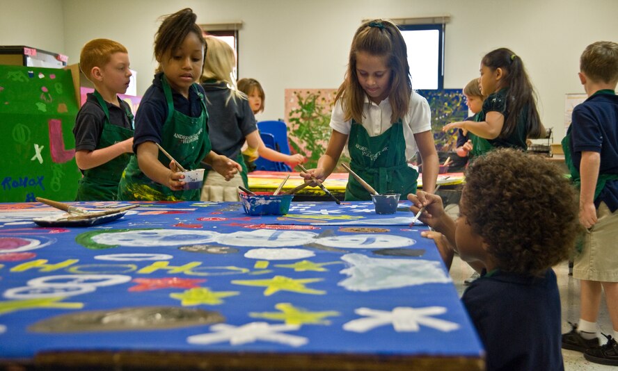 ANDERSEN AIR FORCE BASE, Guam--Children from Andersen Elementary School painted boxes that will be filled with toys, clothing and goods for Operation Christmas Drop Nov. 15 here.Throughout the week of Nov. 14, every grade will participate in decorating these boxes. Operation Christmas Drop is a non-profit organization powered by volunteers from Andersen AFB and the local community and has to date,
dropped more than 800,000 pounds of goods throughout the surrounding
islands. Fundraising for this Operation Christmas Drop is scheduled to
kick-off with a 5K run/walk Nov. 19, followed by a bake sale at the Base
Exchange Nov. 26. In addition to fundraisers, individual and group donations
may also be made to the cause. (U.S Air Force photo by Staff Sgt. Alexandre
Montes)
