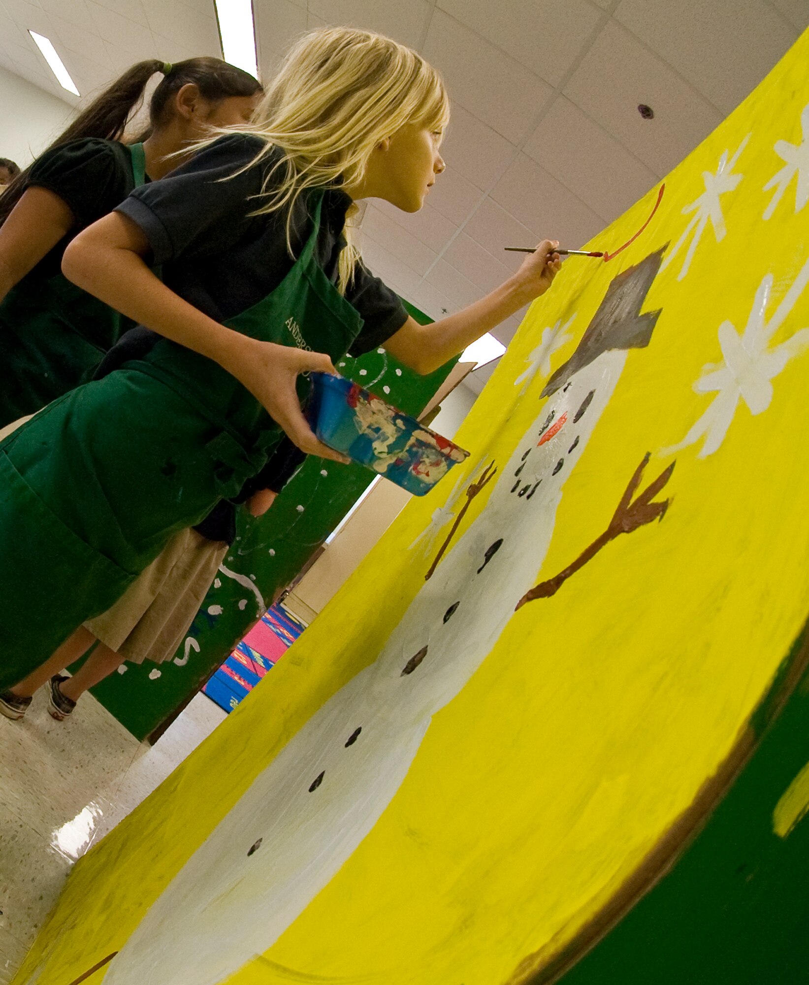 ANDERSEN AIR FORCE BASE, Guam--Children from Andersen Elementary School painted boxes that will be filled with toys, clothing and goods for Operation Christmas Drop Nov. 15 here.Throughout the week of Nov. 14, every grade will participate in decorating these boxes. Operation Christmas Drop is a non-profit organization powered by volunteers from Andersen AFB and the local community and has to date,
dropped more than 800,000 pounds of goods throughout the surrounding
islands. Fundraising for this Operation Christmas Drop is scheduled to
kick-off with a 5K run/walk Nov. 19, followed by a bake sale at the Base
Exchange Nov. 26. In addition to fundraisers, individual and group donations
may also be made to the cause. (U.S Air Force photo by Staff Sgt. Alexandre
Montes)
