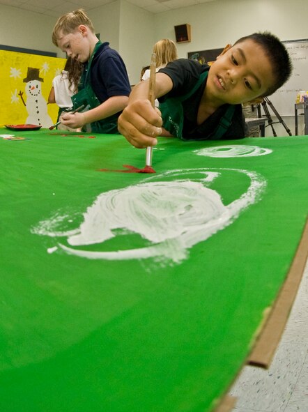 ANDERSEN AIR FORCE BASE, Guam--Children from Andersen Elementary School painted boxes that will be filled with toys, clothing and goods for Operation Christmas Drop Nov. 15 here.Throughout the week of Nov. 14, every grade will participate in decorating these boxes. Operation Christmas Drop is a non-profit organization powered by volunteers from Andersen AFB and the local community and has to date,
dropped more than 800,000 pounds of goods throughout the surrounding
islands. Fundraising for this Operation Christmas Drop is scheduled to
kick-off with a 5K run/walk Nov. 19, followed by a bake sale at the Base
Exchange Nov. 26. In addition to fundraisers, individual and group donations
may also be made to the cause. (U.S Air Force photo by Staff Sgt. Alexandre
Montes)
