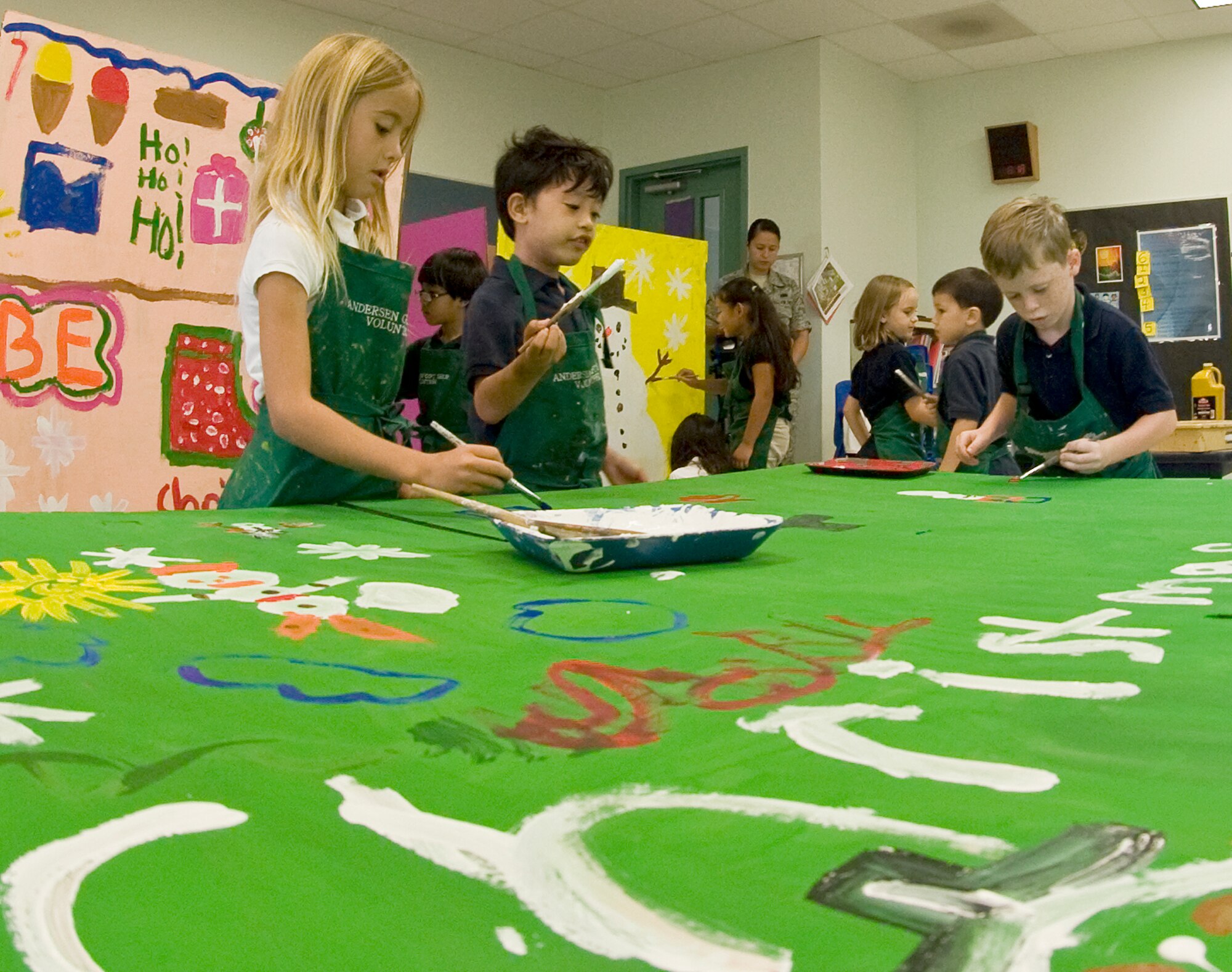 ANDERSEN AIR FORCE BASE, Guam--Children from Andersen Elementary School painted boxes that will be filled with toys, clothing and goods for Operation Christmas Drop Nov. 15 here.Throughout the week of Nov. 14, every grade will participate in decorating these boxes. Operation Christmas Drop is a non-profit organization powered by volunteers from Andersen AFB and the local community and has to date,
dropped more than 800,000 pounds of goods throughout the surrounding
islands. Fundraising for this Operation Christmas Drop is scheduled to
kick-off with a 5K run/walk Nov. 19, followed by a bake sale at the Base
Exchange Nov. 26. In addition to fundraisers, individual and group donations
may also be made to the cause. (U.S Air Force photo by Staff Sgt. Alexandre
Montes)
