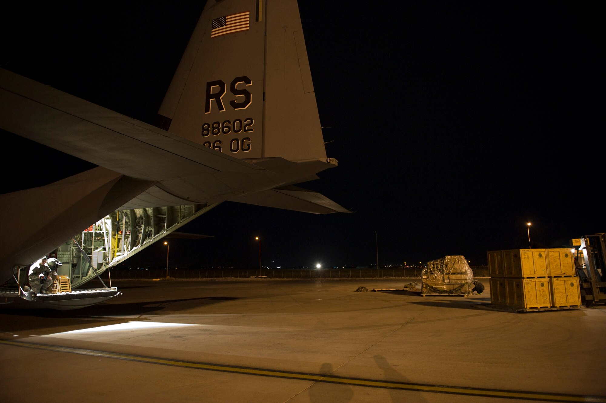Flight crew from the 37th Airlift Squadron, Ramstein Air Base, Germany unloaded a C-130J Hercules aircraft with pallets of supplies from Stjordal, Norway, Nov. 15. The effort is in support of the Turkey-led relief efforts following the Nov. 9, and Oct. 23, earthquake in Van province, Turkey. At the request of the Turkish government the Department of Defense has tasked U.S. European Command to airlift relief supplies to Van province.  (U.S. Air Force photo/MSgt Wayne Clark, AFNE Regional News Bureau) (Released)