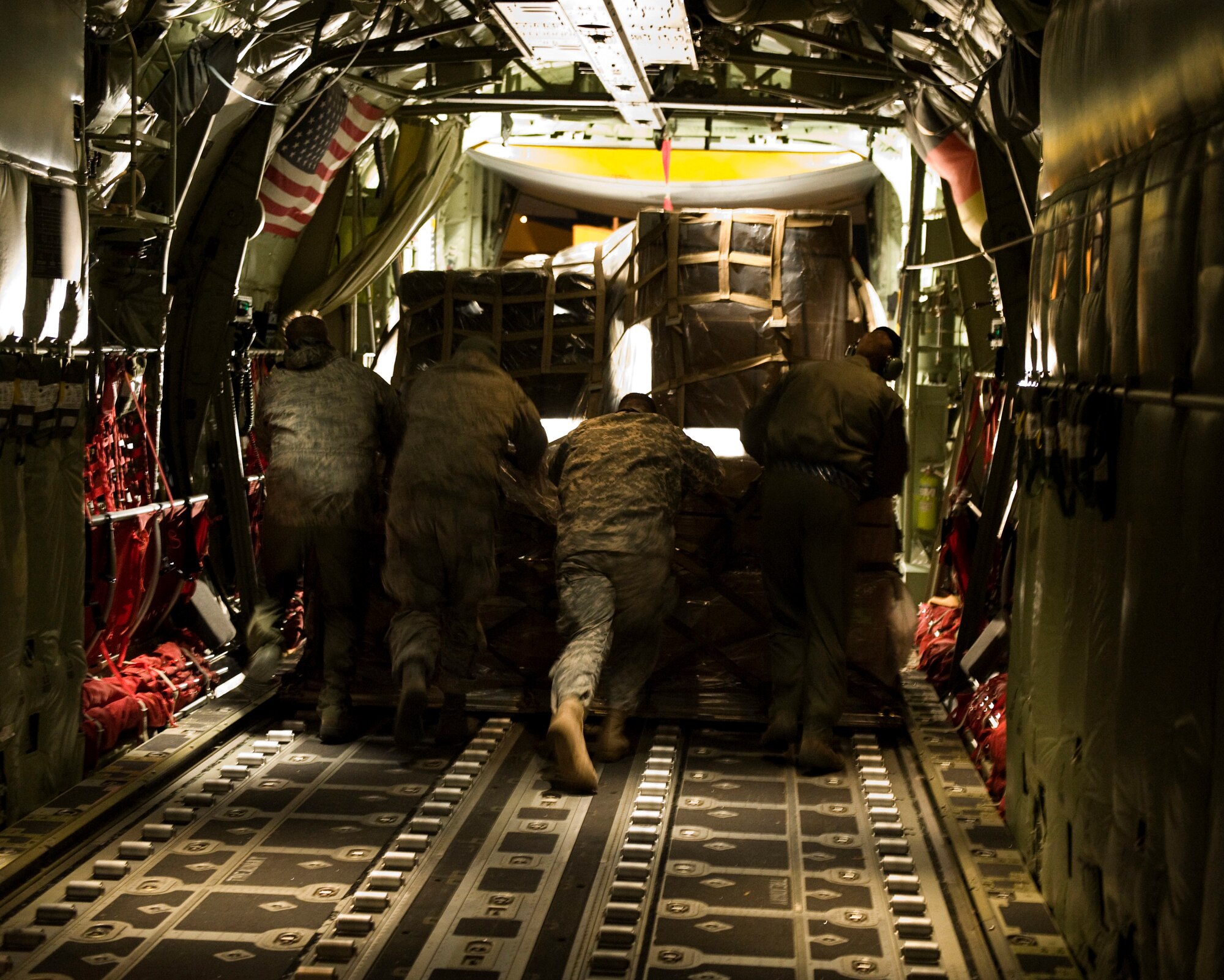 Flight crew from the 37th Airlift Squadron, Ramstein Air Base, Germany unload C-130J Hercules aircraft with pallets of supplies from Stjordal, Norway, Nov. 15. The effort is in support of the Turkey-led relief efforts following the Nov. 9, and Oct. 23, earthquake in Van province, Turkey. At the request of the Turkish government the Department of Defense has tasked U.S. European Command to airlift relief supplies to Van province.  (U.S. Air Force photo/MSgt Wayne Clark, AFNE Regional News Bureau) (Released)