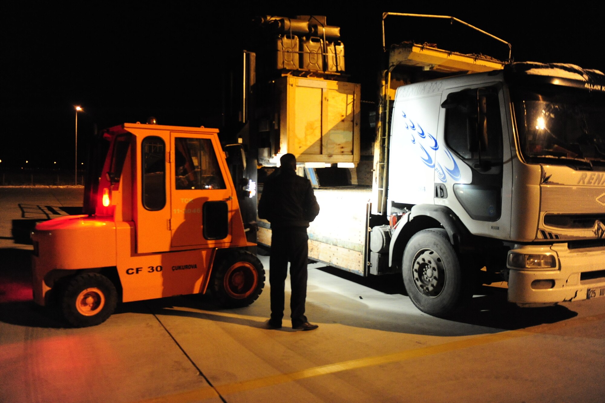 United States personnel from the 37th Airlift Squadron and civilian and military personnel from Turkey unload pallets of supplies and equipment off of a C-130 in Van province, Turkey on Nov. 14. The pallets are flown to Turkey via a C-130 Hercules ???Christine??? to assist in humanitarian relief efforts in the aftermath of two major earthquakes that struck the country. (U.S. Army photo by Spc. Jason A. Blackburn/Released)