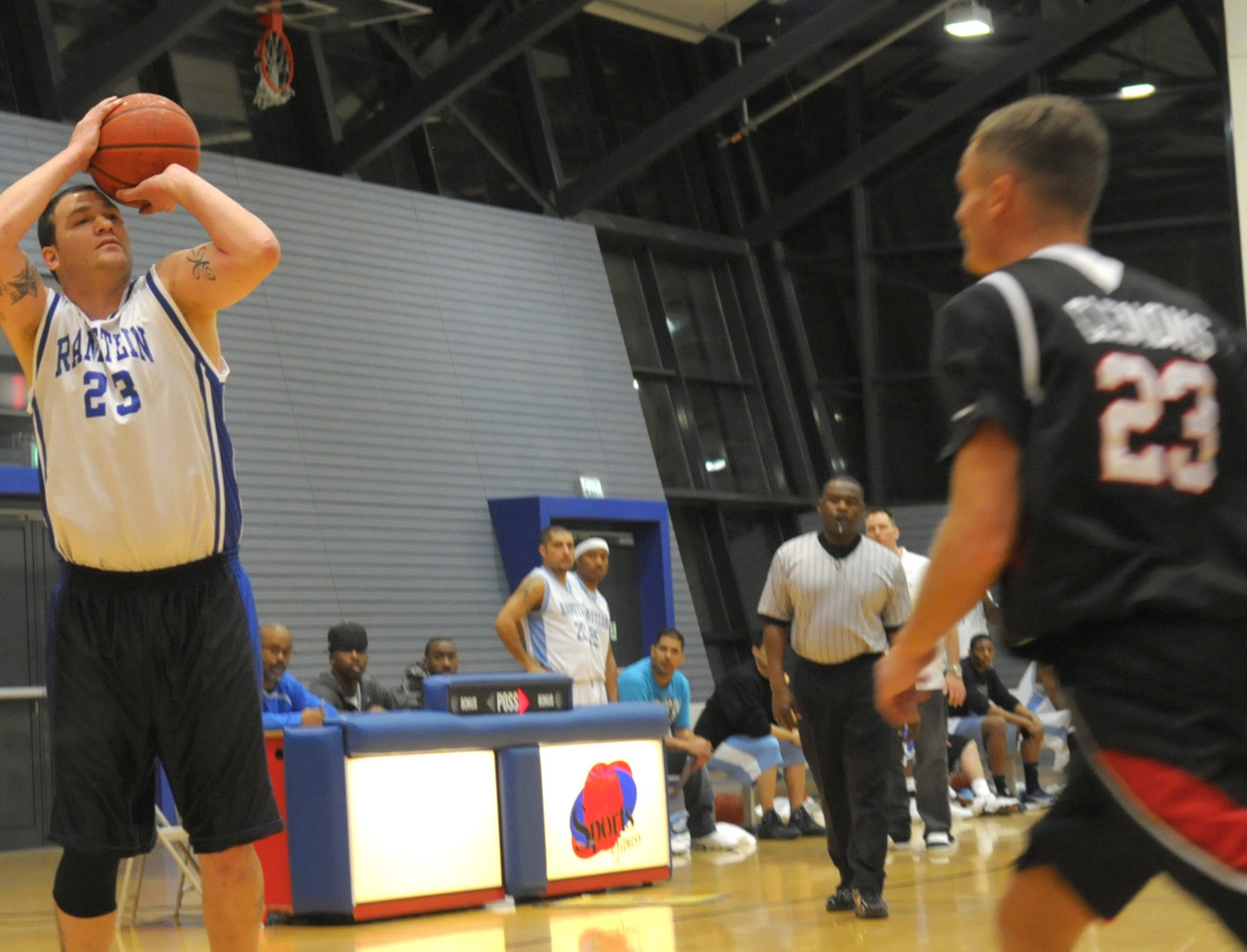 Ramstein Rams Anthony Calogero,23, takes a shot from downtown in the Veteran's Day Basketball Tournament at the Southside Fitness Center at Ramstein Air Base, Germany, Nov 13, 2011. The Rams beat the Spangdahlem Sabers 72-51 in the championship game. (U.S. Air Force photo/Staff Sgt. Travis Edwards)