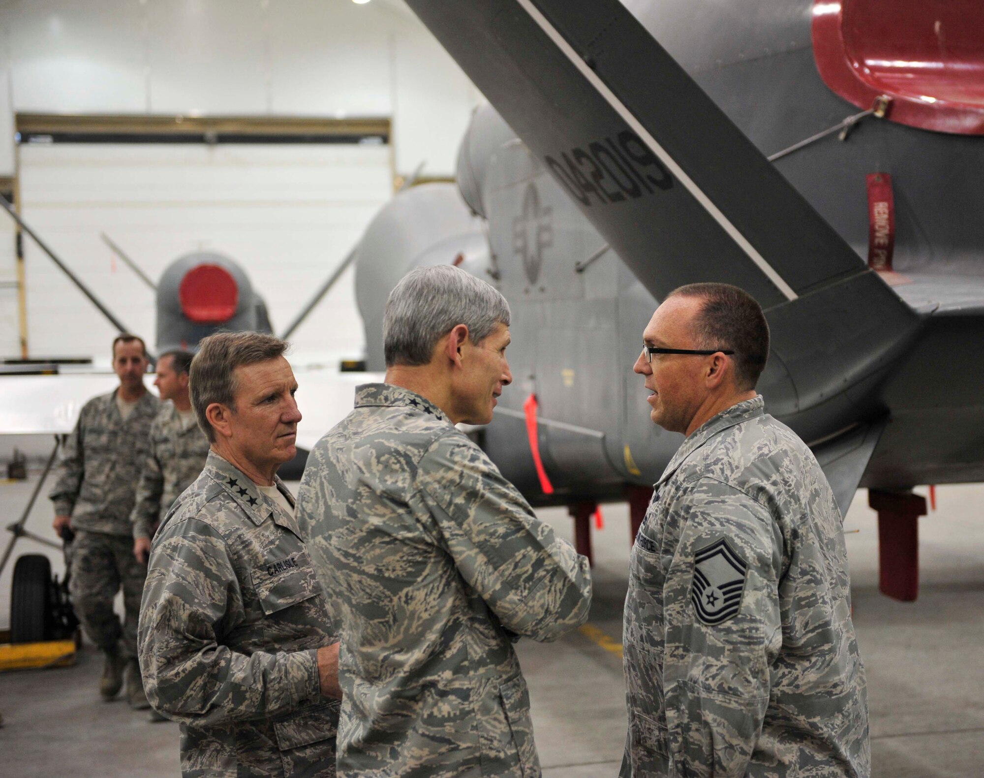 Air Force Chief of Staff Gen. Norton Schwartz and Lt. Gen. Herbert Carlisle,
the Air Force deputy chief of staff for operations, plans and requirements,
talk with  Senior Master Sgt. Christian Cahalan from the 380th Expeditionary
Aircraft Maintenance Squadron during a visit to the 380th Air Expeditionary
Wing Nov. 14, 2011. The chief of staff visited Airmen throughout the U.S.
Central Command area of responsibility in conjunction with attending the
Dubai International Air Chiefs Conference.  Cahalan is the superintendent
for the RQ-4 Global Hawk aircraft maintenance unit.  His hometown is Sioux
Falls, S.D.  (U.S. Air Force photo/Tech. Sgt. Patrick Mitchell)
