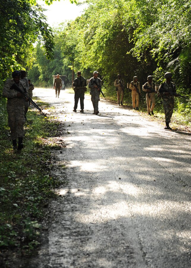 U.S. and Domincan Republic Marines practice patrolling the road.  The two Marine Corps are participating in a three week partnership as part of Southern Partnership Station (SPS) 2012. SPS is an annual deployment in the U.S. Southern Command's Area of Responsibility, partnering the Caribbean and Latin America.