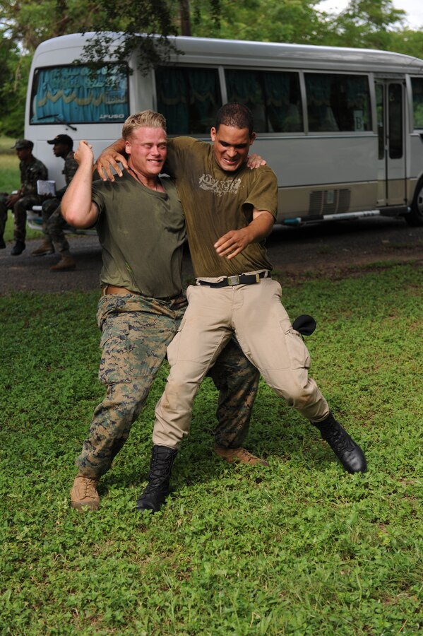 Cpl. Lucas Ottander-Todd, assigned to the Marine detachment of High Speed Vessel (HSV 2) Swift, works with Dominican Republic Marines on Marine Corps martial arts.  The two Marine Corps are participating in a three week partnership as part of Southern Partnership Station (SPS) 2012. SPS is an annual deployment in the U.S. Southern Command's Area of Responsibility, partnering the Caribbean and Latin America.