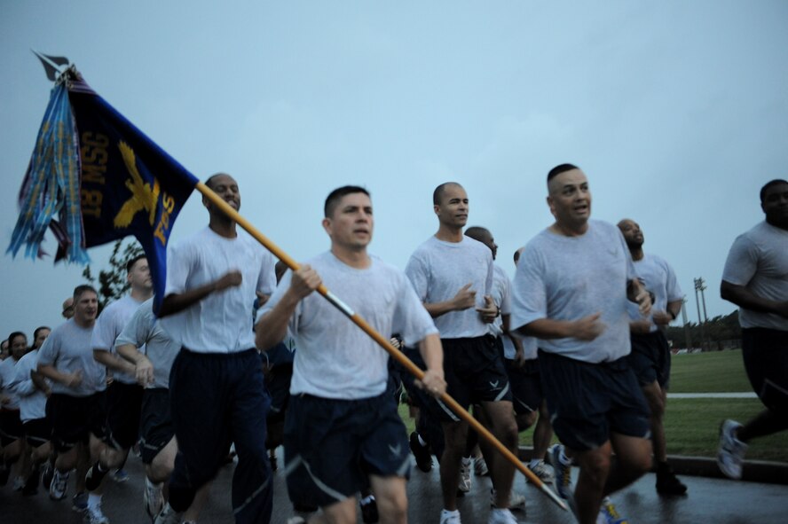 Airmen from the 18th Mission Support Group participate in the Wingman Day run on Kadena Air Base, Japan, Nov. 18, 2011. Wingman Day is designed to improve the resiliency of individuals through structured discussion in small groups and team-building exercises at the squadron level. (U.S. Air Force photo/Senior Airman Jarvie Z. Wallace/Released)