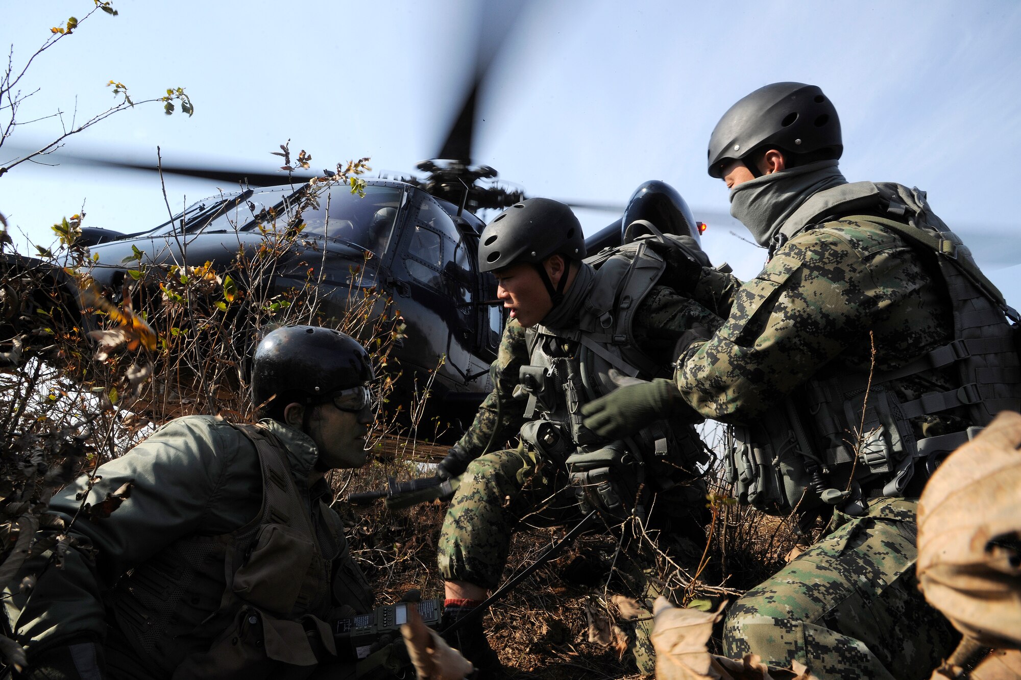 Maj. Jared Johnson, 8th Operations Group chief of standards and evaluations and F-16 pilot, is approached by Republic of Korea Air Force Special Forces during a Peninsula-wide Operational Readiness Exercise in Jeongan-myeon, Republic of Korea, on Nov. 16, 2011.  Johnson simulated a downed pilot in his scenario. His scenario was one of the many during the PENORE to prepare the Wolf Pack for wartime contingencies and their operational readiness inspection. (U.S. Air Force photo by Staff Sgt. Rasheen Douglas/Released)