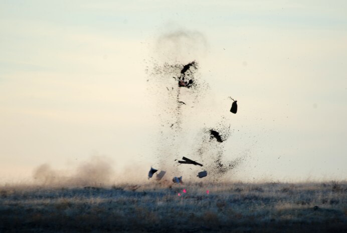A controlled explosion detonates a live mortar found in a field by a team using magnameters, industrial grade metal detectors, at Beale Air Force Base Calif., November 16, 2011. The field was formally used from World War II to 1956 as a mortar range. (U.S. Air Force photo by Airman 1st Class Shawn Nickel/Released)