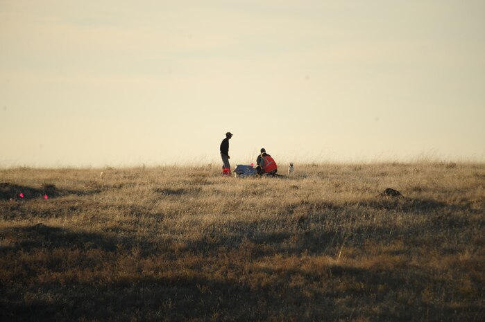 A team of technicians from URS Corporation, a contracted explosive ordinance disposal company hired to clear portions of the base formally used as mortar ranges, stacks sandbags and prepares explosives to dispose of a live mortar found at Beale Air Force Base, Calif., November 16, 2011. Sandbags are used to reduce noise and impact of the explosion. (U.S. Air Force photo by Airman 1st Class Shawn Nickel/Released)