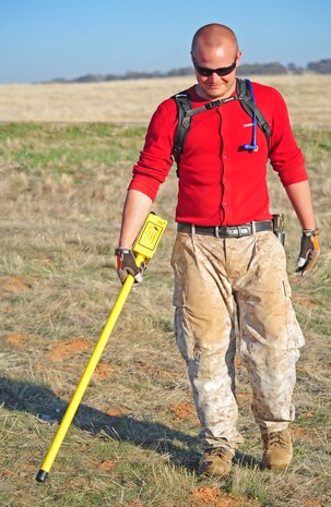 Stephen Baker, URS Corporation supervisor, displays an exploded 1946 era 81mm HE mortar at Beale Air Force Base, Calif., November 16, 2011, which was the former Camp Beale. The ordinance was found in a retired bombing range used for training during and after World War II. (U.S. Air Force photo by Airman 1st Class Shawn Nickel/Released)