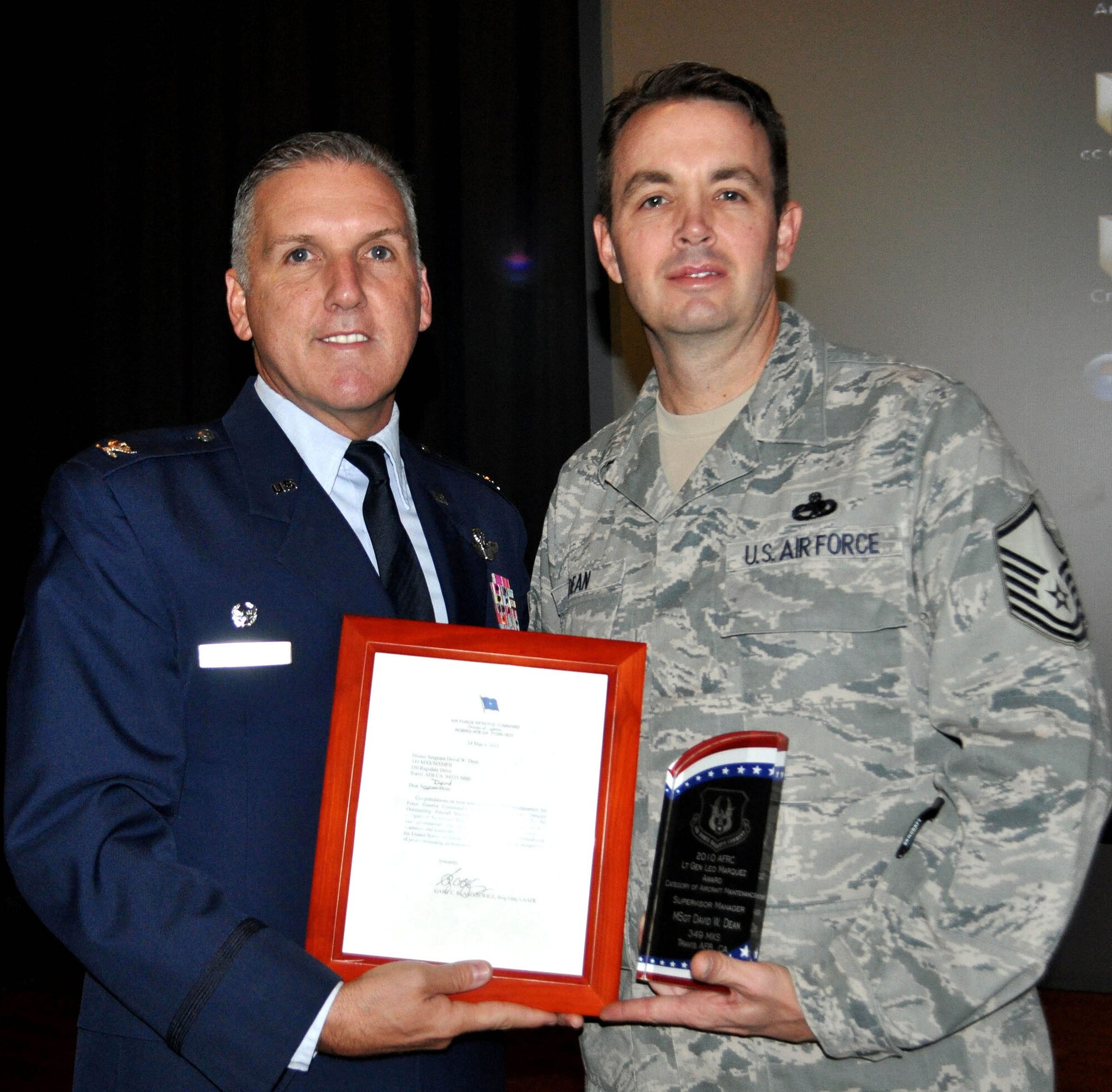 TRAVIS AIR FORCE BASE, Calif. -- At Commander's Call Oct. 23, Col. Jay Flournoy presented Master Sgt. David Dean, 349th Maintenance Squadron with the 2010 Lt. Gen. Leo Marquez award as the Air Force Reserve Command supervisor/manager of the year. (U.S. Air Force photo/Senior Master Sgt. Ellen Hatfield)
