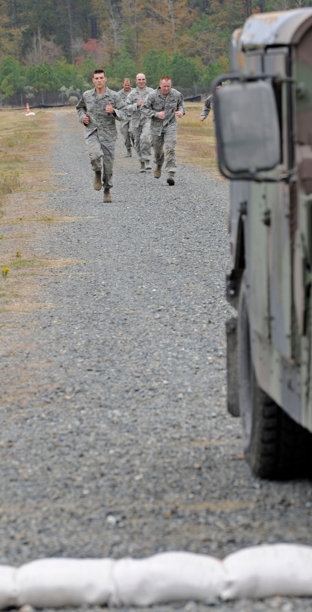 CAMP MINDEN, La. - The 509th Security Forces Squadron sprints to the finish line to end thier portion of the mental and physical challenge event during the second annual Global Strike Challenge at Camp Minden, La., Nov. 7. Global Strike Challenge is the premier bomber, Intercontinental Ballistic Missile and security forces competition with units from Air Force Global Strike Command, Air Combat Command, Air Force Reserve Command and the Air National Guard.  (U.S. Air Force photo/Staff Sgt. Alexandra M. Boutte) 