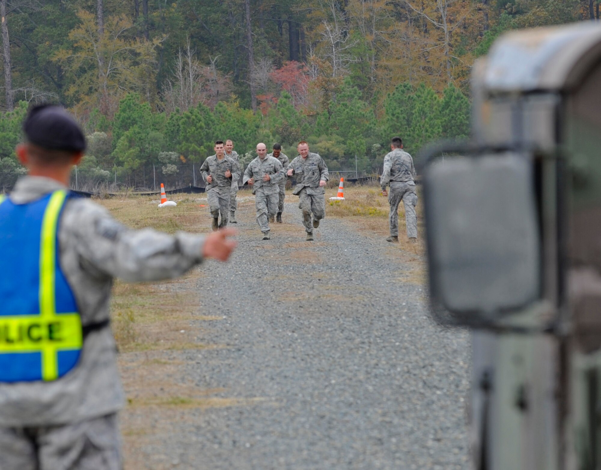 Camp Minden, La. - The 509th Security Forces Squadron sprints to the finish line to end thier portion of the mental and physical challenge event during the second annual Global Strike Challenge at Camp Minden, La., Nov. 7. Global Strike Challenge is the premier bomber, Intercontinental Ballistic Missile and security forces competition with units from Air Force Global Strike Command, Air Combat Command, Air Force Reserve Command and the Air National Guard.  (U.S. Air Force photo/Staff Sgt. Alexandra M. Boutte) 