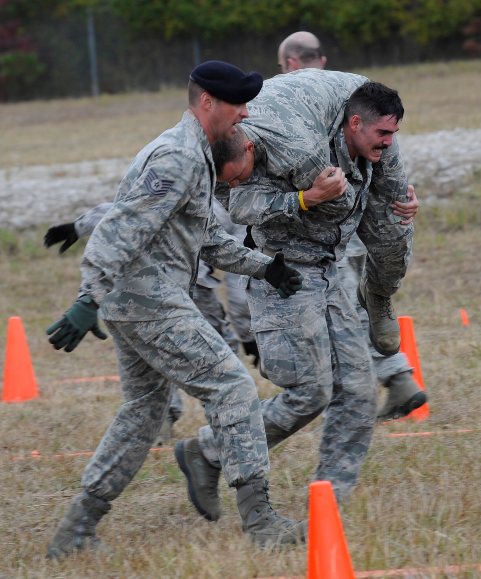 CAMP MINDEN, La. - Senior Airman James Doan, 509th Security Forces Squadron lifts up a volunteered participant into the fireman's carry during the physical portion of the mental and physical challenge of the second annual Global Strike Challenge at Camp Minden, La., Nov. 7. Following the physical portion, team members sprint to the finish line for final their final time. The score-posting will include winners of security forces along with missile and bomber forces from Air Force Global Strike Command on Nov. 8-9. (U.S. Air Force photo/Staff Sgt. Alexandra M. Boutte) (RELEASED)