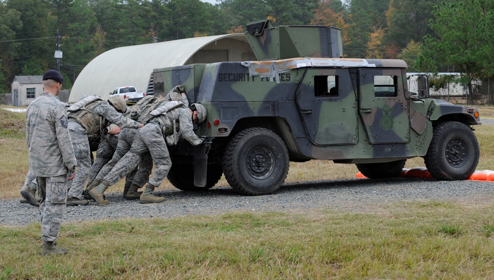 CAMP MINDEN, La. - The 509th Security Forces Squadron pushes the up-armored Humvee down a stretch of road during a phase of the mental and physical challenge of the second annual Global Strike Challenge at Camp Minden, La., Nov. 7. The Humvee is a 2-ton armored, deployed tactical vehicle. The competition includes security forces along with missile and bomber forces from Air Force Global Strike Command. The teams have the opportunity to participate in innovative thinking, teamwork and esprit de corps that are central to the GSC mission. (U.S. Air Force photo/Staff Sgt. Alexandra M. Boutte) (RELEASED)