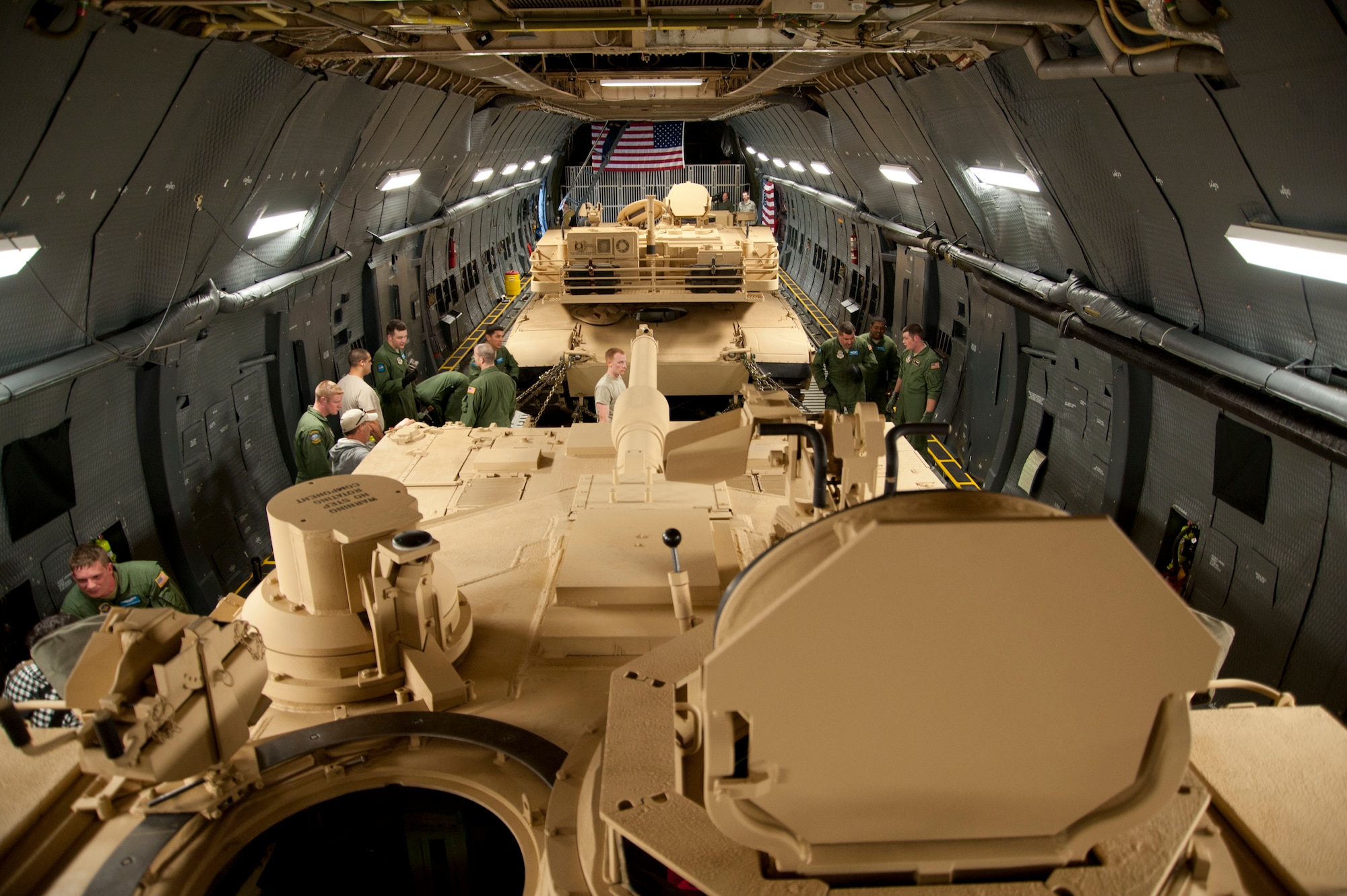 Two M-1 Abrams tanks from Aberdeen Proving Ground, Md., are loaded in the cargo area of a C-5M Super Galaxy assigned to Dover Air Force Base, Del. The C-5M currently holds 42 world aviation records in airlift. The modernized version of the C-5, the Super Galaxy has 70 improvements, including new GE CF6 engines providing 22 percent more thrust and cutting climb time in half. New lighting in the cargo area increases safety of loading and offloading cargo. (U.S. Air Force photo/Lt. Col. Chad E. Gibson)