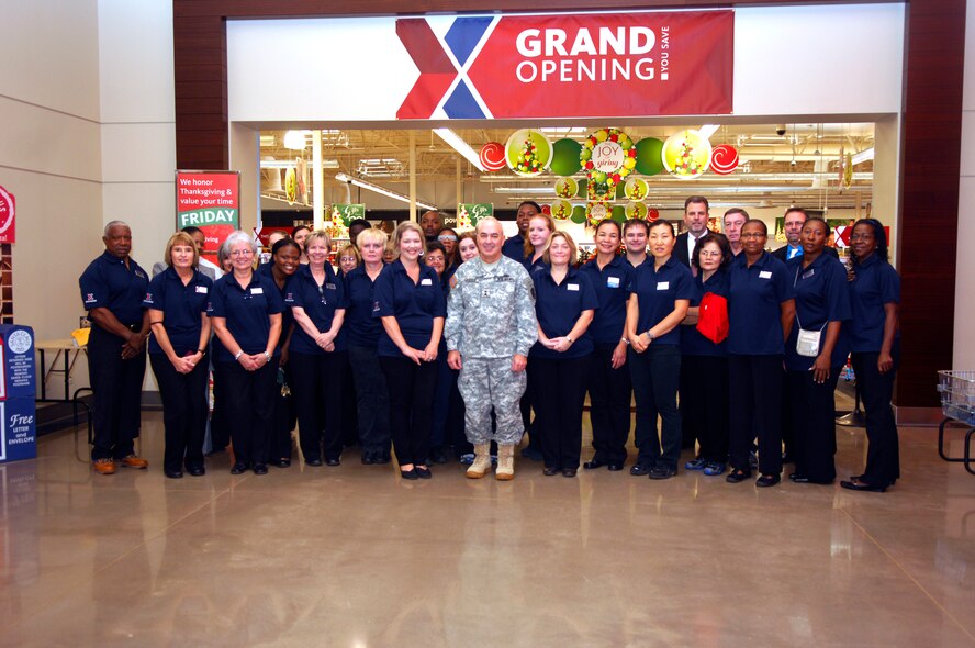 U.S. Army Maj. Gen. Bruce Casella, Army and Air Force Exchange Services commanding general, takes a photo with the AFFES staff members, Shaw Air Force Base, S.C. Nov.17, 2011. The new Exchange will replace the oldest Exchange in the Air Force. (U.S. Air Force photo by Airman 1st Class Ashley L. Gardner/ Released)