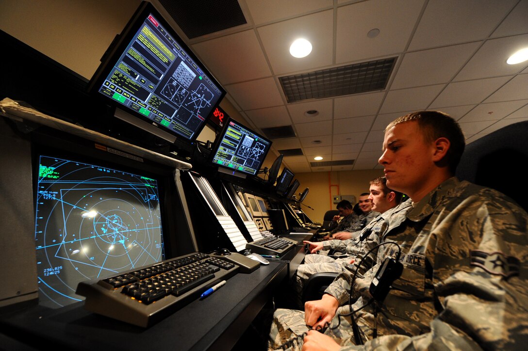 Airman 1st Class Andrew Ahrendt, 28th Operations Support Squadron air traffic controller apprentice, monitors air traffic for North and South Dakota at the Radar Approach Control building on Ellsworth Air Force Base, S.D., Nov. 15, 2011. RAPCON coordinates and provides safe flight paths to aircraft to ensure there are no obstructions to cause collisions. (U.S. Air Force photo by Airman 1st Class Zachary Hada/Released)