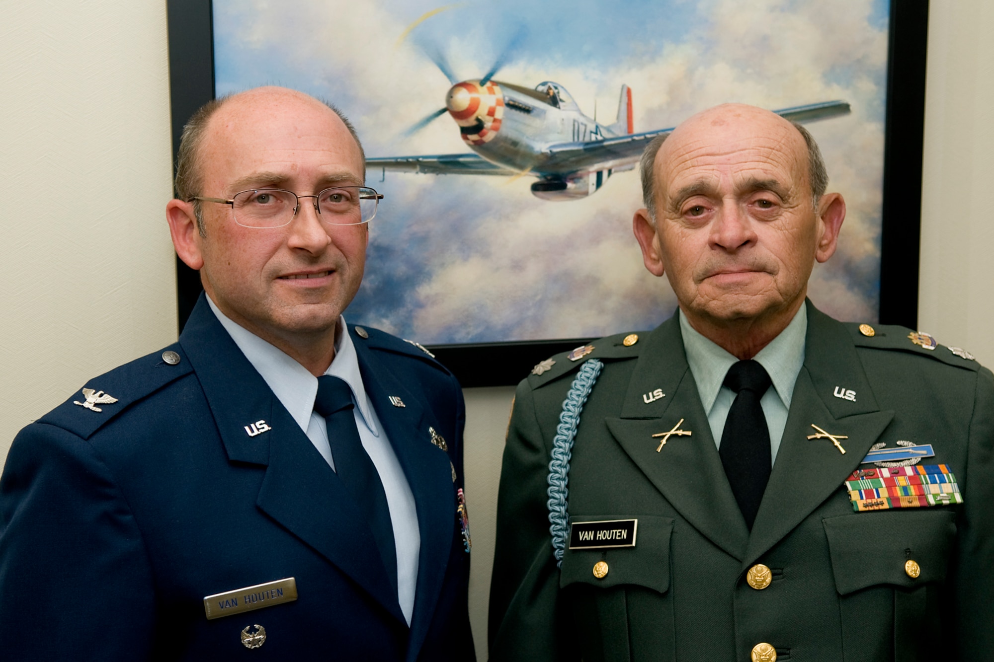 GRISSOM AIR RESERVE BASE, Ind. -- Col. Arthur L. Van Houten III, left, poses for a photo with his father, retired U.S. Army Lt. Col. Arthur L. Van Houten II, after his promotion ceremony Oct. 23. The last time the two were in uniform together was the day the father pinned lieutenant bars on his son his his commissioning ceremony. The younger Van Houten served as the 434th Maintenance Group deputy commander until his promotion. He will now serve as the senior individual mobilization augmentee for the 402nd Maintenance Wing commander at Robins Air Force Base, Ga. (U.S. Air Force photo/Tech. Sgt. Mark R. W. Orders-Woempner)

