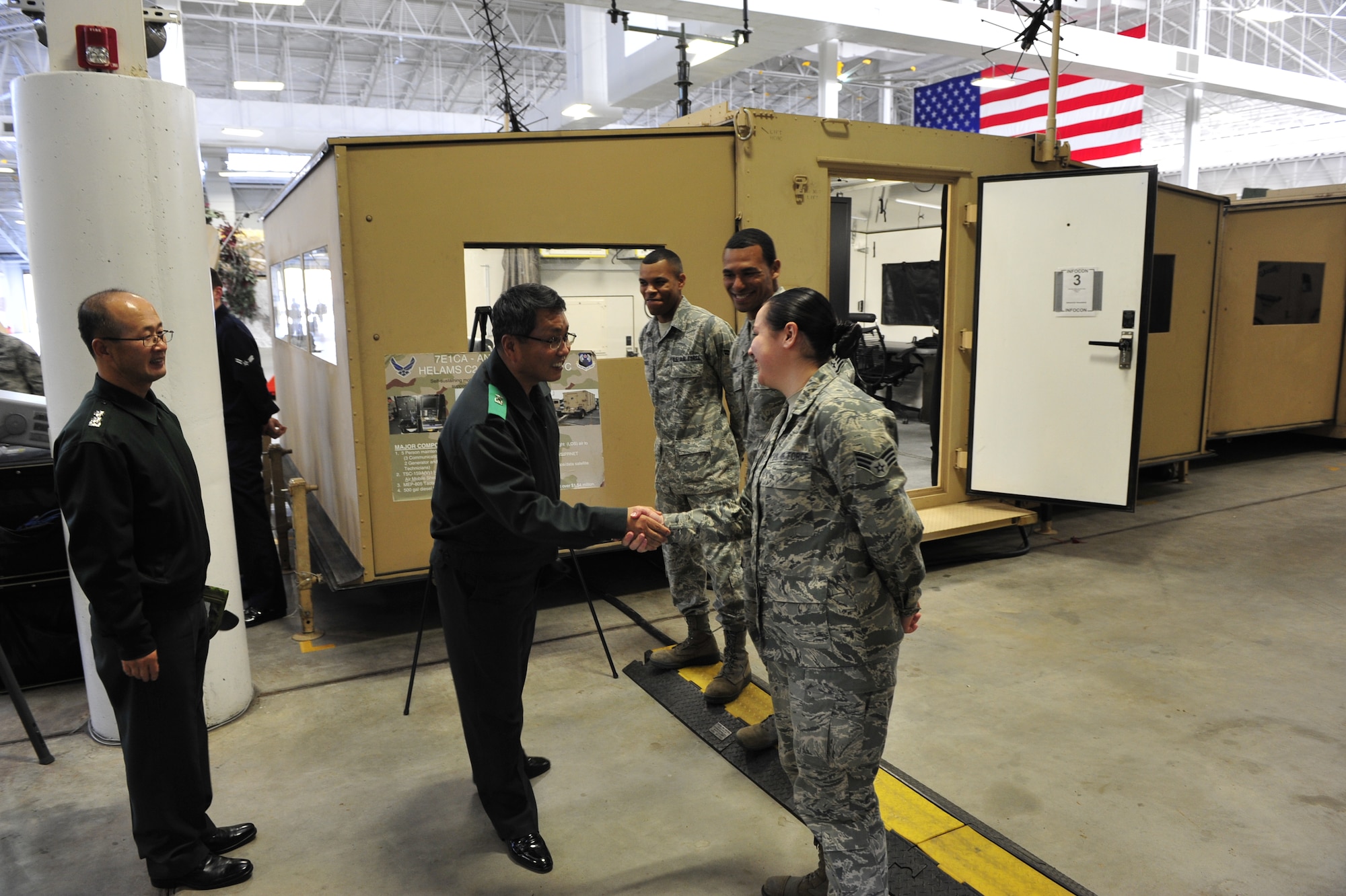 Brig. Gen. Gwi Chel Seo, commander of Transportation Command, Republic of Korea, meets with Airmen during his tour of the 621st Contingency Response Wing's Global Reach Deployment Center here Nov. 14. General Seo and his staff spent the morning with the CRW, learning about Joint Task Force - Port Opening operations. (U.S. Air Force photo by Tech. Sgt. Parker Gyokeres/released)

