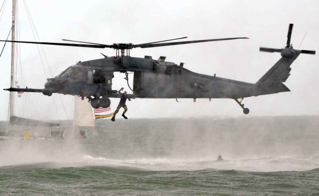 Airmen from the 920th Rescue Wing perform a water rescue demonstration using an HH-60G Pave Hawk Nov. 5, 2011, during the Cocoa Beach Air Show 2011 in Cocoa Beach, Fla. (U.S. Air Force photo/Staff. Sgt. Anna-Marie Wyant).