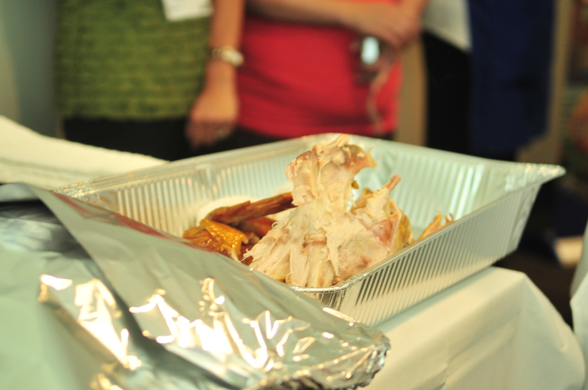 Students view the remnants of a turkey carved by Butterball master chef Tony Seta during a session at Butterball University in Garner, N.C., Nov. 15, 2011. More than 30 military spouses, retirees and servicemembers attended Butterball University, which teaches skills in turkey preparation and food safety. The course is similar to the training given to Butterball Turkey Talk Line operators, who operate a hotline for anyone with questions about preparing turkey on Thanksgiving Day. (U.S. Air Force photo by Senior Airman Marissa Tucker)