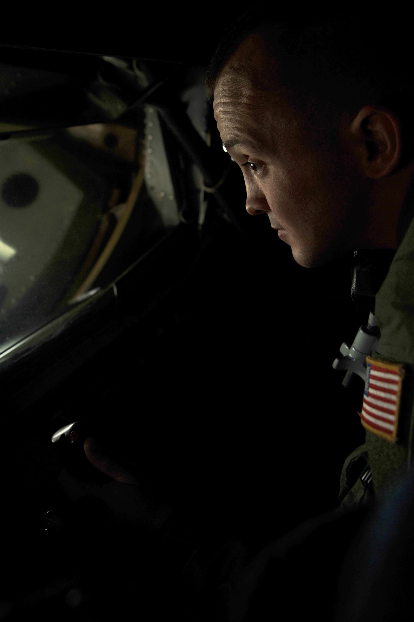 Airman 1st Class James Michel Jr., 384th Air Refueling Squadron boom operator, examines the boom pod of a KC-135 Stratotanker assigned to McConnell Nov. 16, 2011, McConnell Air Force Base, Kan.  The St. Louis, Mo.,native conducts in-flight refueling for foreign and domestic aircraft.  (U.S. Air Force photo/Senior Airman Abigail Klein)