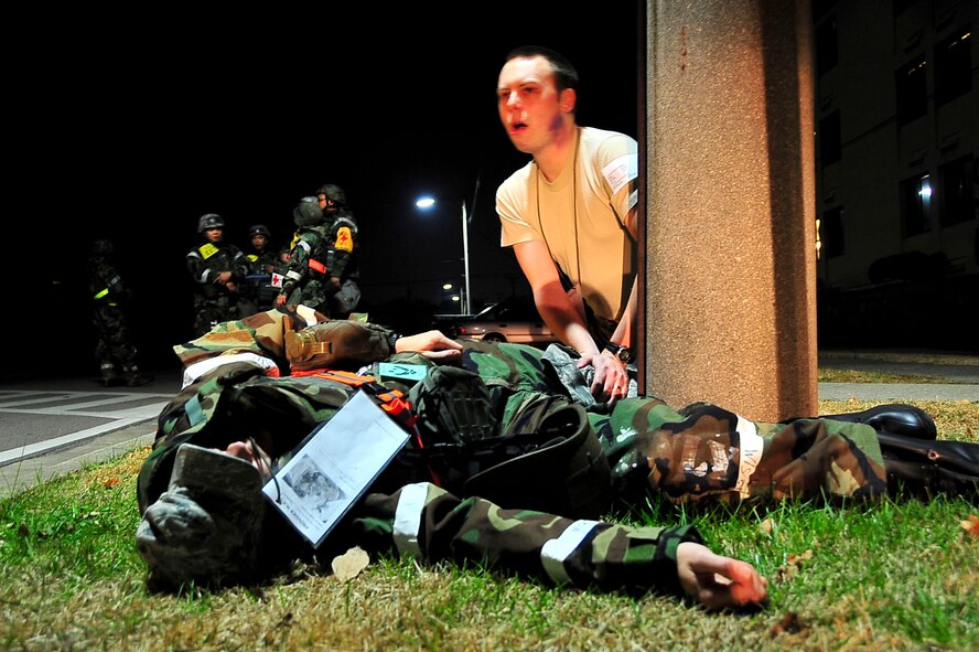 Members of the 51st Medical Group and Osan Fire Depratment respond to a simulated crash Nov. 17, 2011, during Beverly Bulldog 11-03, a pen-wide operational readiness exercise. The exercise allows Airmen to demonstrate their ability to complete the mission in a simulated hostile environment while executing their primarily duties. (U.S. Air Force photo/Senior Airman Adam Grant)