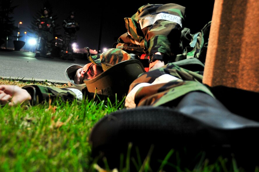 Members of the 51st Medical Group and Osan Fire Depratment respond to a simulated crash Nov. 17, 2011, during Beverly Bulldog 11-03, a pen-wide operational readiness exercise. The exercise allows Airmen to demonstrate their ability to complete the mission in a simulated hostile environment while executing their primarily duties. (U.S. Air Force photo/Senior Airman Adam Grant)