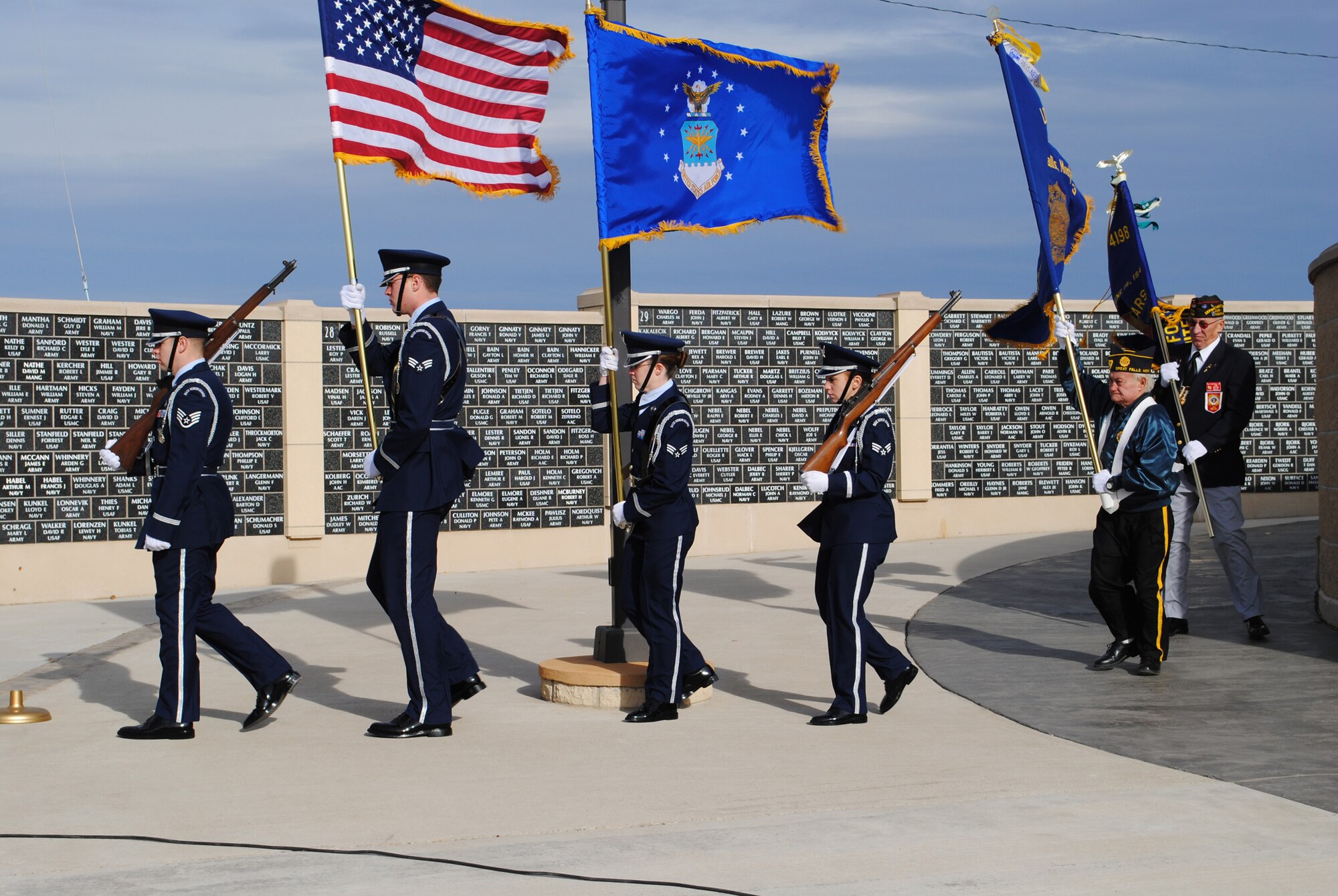 Members of Malmstrom's Honor Guard, along with veteran honor guard members, present the colors, beginning the Veterans Day ceremony at the Great Falls Veterans Memorial Nov. 11. (U.S. Air Force photo/Airman Cortney Paxton)