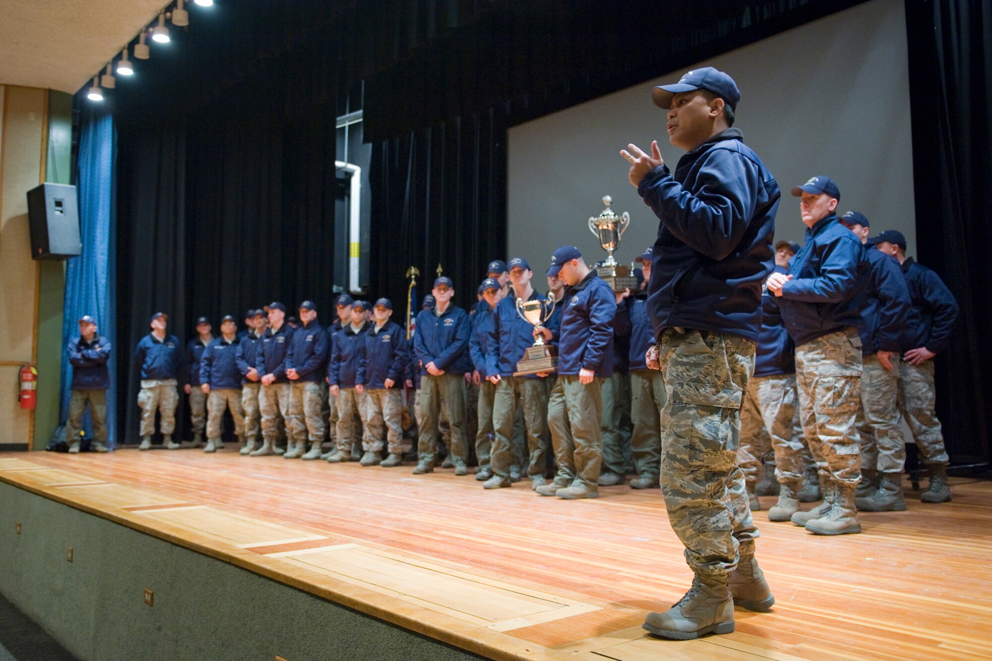 Col. H.B. Brual, 341st Missile Wing commander, addresses the audience at the base theater that gathered Nov. 10 to welcome home the Global Strike Challenge team after their competition. (U.S. Air Force photo/Beau Wade)