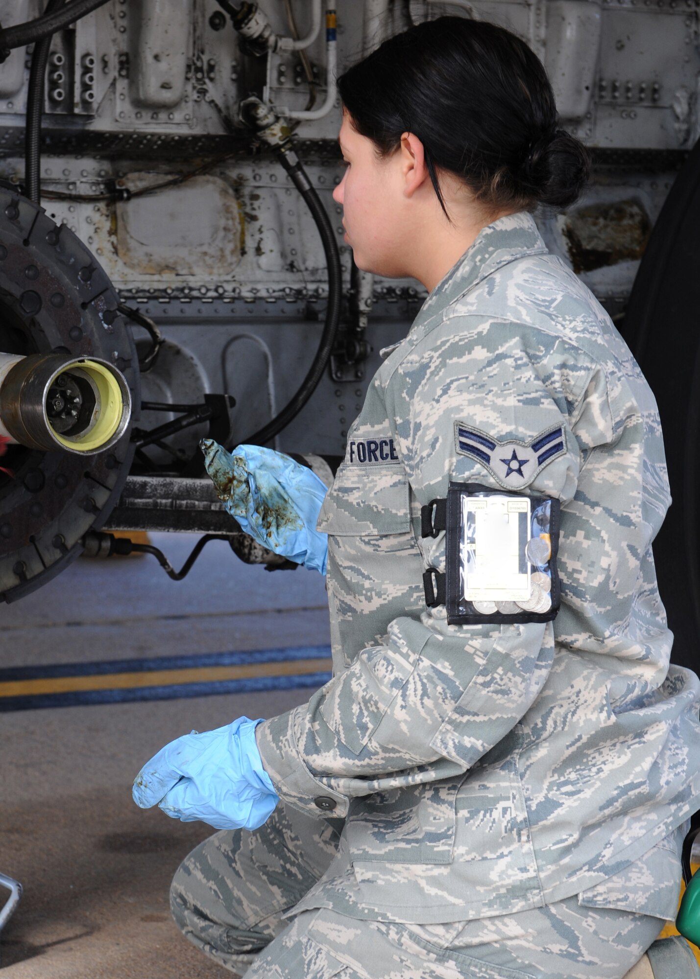 Airman 1st Class Jessica Niebauer, 317th Aircraft Maintenance Squadron, prepares a C-130 Hercules for a brake change during training Nov. 16, 2011 at Dyess Air Force Base, Texas. Airmen from the 317 AMXS undergo additional training to stay updated on the C-130 H. (U.S. Air Force photo by Airman 1st Class Jonathan Stefanko/ Released)