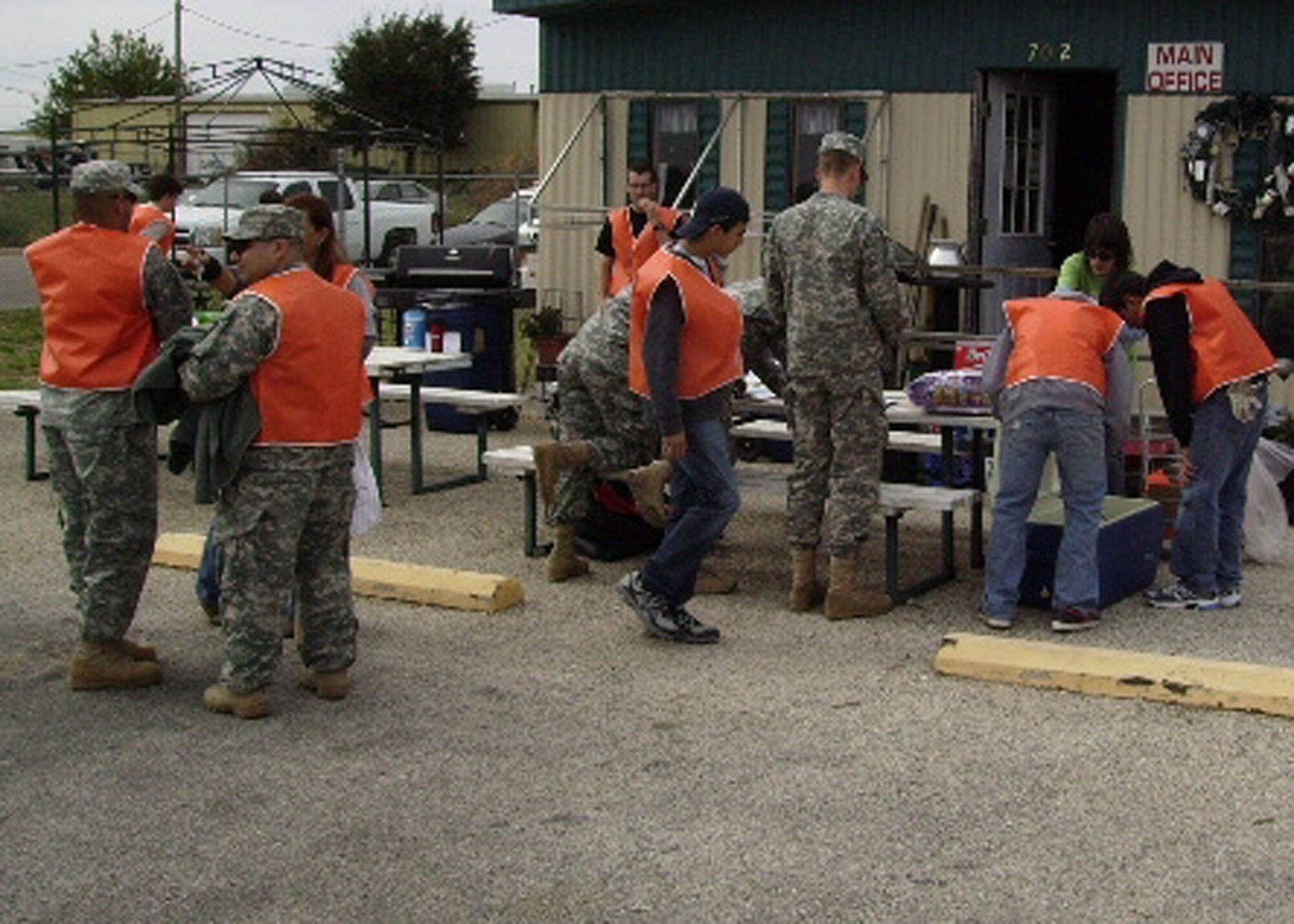 SAN ANGELO, Texas -- Airmen and Soldiers from Goodfellow Air Force Base checks in during the Fifth Annual Texas Recycles Day Nov. 12, at the community recycling center in San Angelo. More than 600 cars dropped off material, doubling the amount collected last year. Goodfellow’s qualified recycling program manager participated in the event as well. (Courtesy photo)