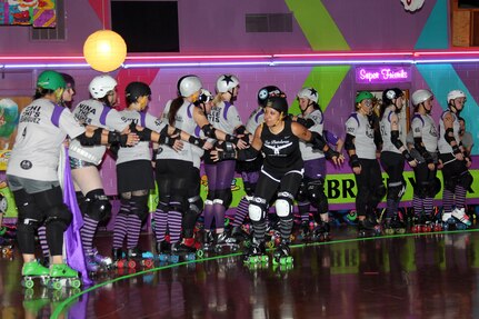 Staff Sgt. Melissa Hernandez from the Air Force Personnel Center's Total Force Service Center shakes hands before her first bout with the Alamo City Roller Girls' Las Tejanas roller derby team Nov. 6. (U.S. Air Force photo/Tech. Sgt. Steve Grever)