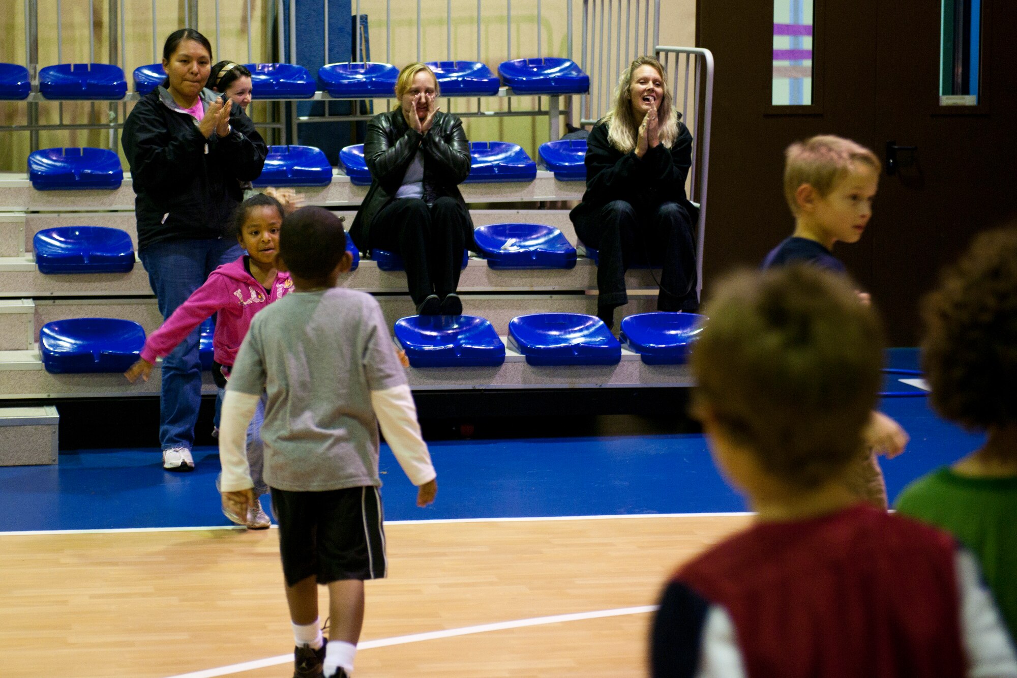 Parents cheer for their children during football mini-camp Nov. 16, 2011, at Incirlik Air Base, Turkey. The camp, hosted by the youth center, was held Nov. 14-18 in lieu of the youth football season and featured instruction on a variety of techniques for beginning players. (U.S. Air Force photo by Tech. Sgt. Michael B. Keller)