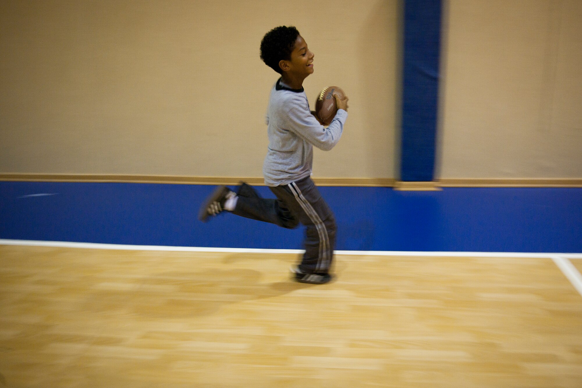 A child runs the ball during a football mini-camp Nov. 16, 2011, at Incirlik Air Base, Turkey. The camp, hosted by the youth center, was held Nov. 14-18 in lieu of the youth football season and featured instruction on a variety of techniques for beginning players. (U.S. Air Force photo by Tech. Sgt. Michael B. Keller)