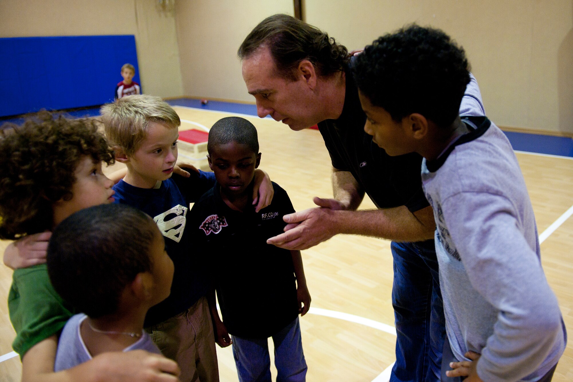 Marcus Grothues, 39th Force Support Squadron youth program specialist, gives instructions to children participating in a football mini-camp Nov. 16, 2011, at Incirlik Air Base, Turkey. The camp, hosted by the youth center, was held Nov. 14-18 in lieu of the youth football season and featured instruction on a variety of techniques for beginning players. (U.S. Air Force photo by Tech. Sgt. Michael B. Keller)