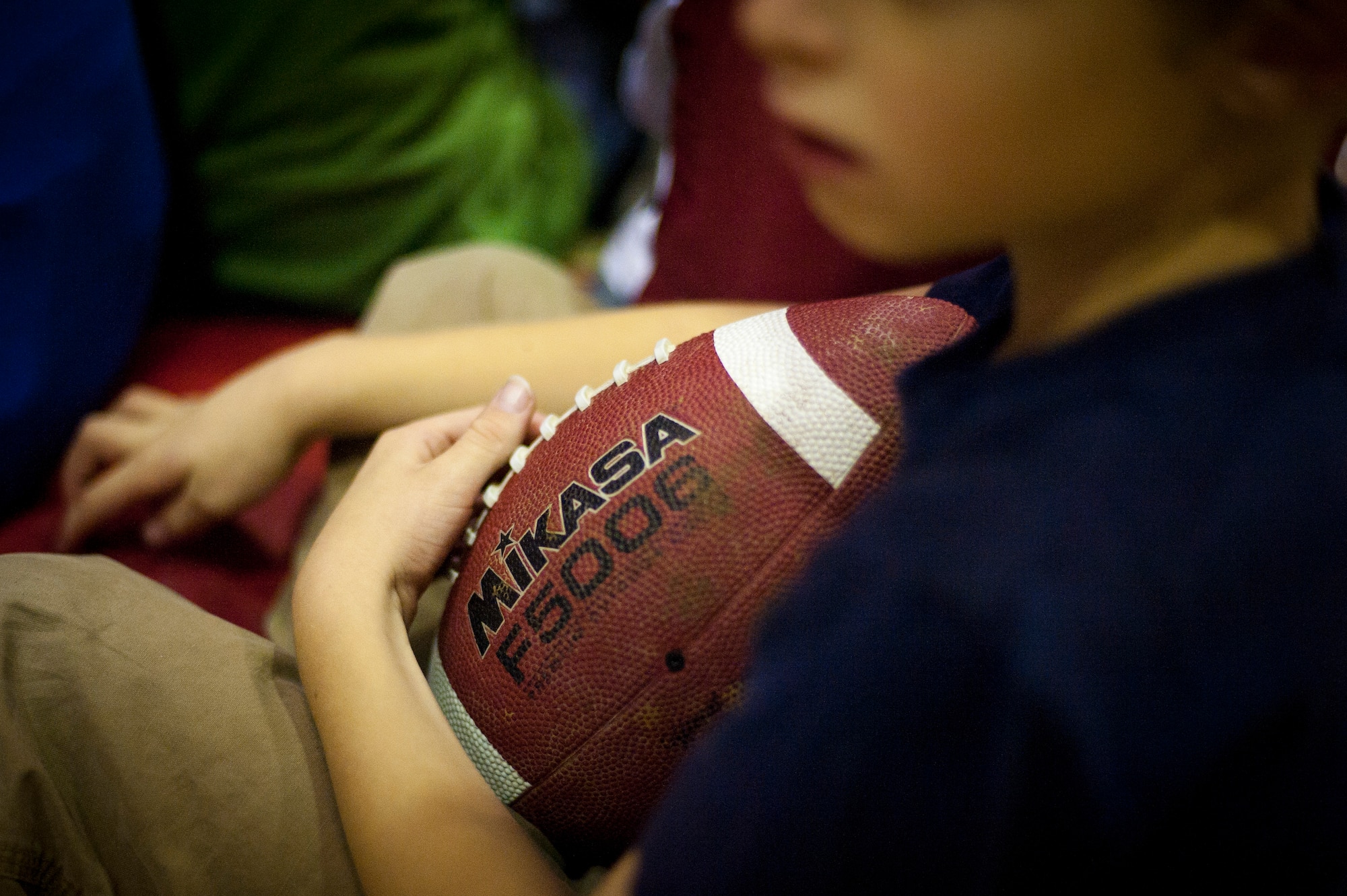 A child holds a ball during a football mini-camp Nov. 16, 2011, at Incirlik Air Base, Turkey. The camp, hosted by the youth center, was held Nov. 14-18 in lieu of the youth football season and featured instruction on a variety of techniques for beginning players. (U.S. Air Force photo by Tech. Sgt. Michael B. Keller)