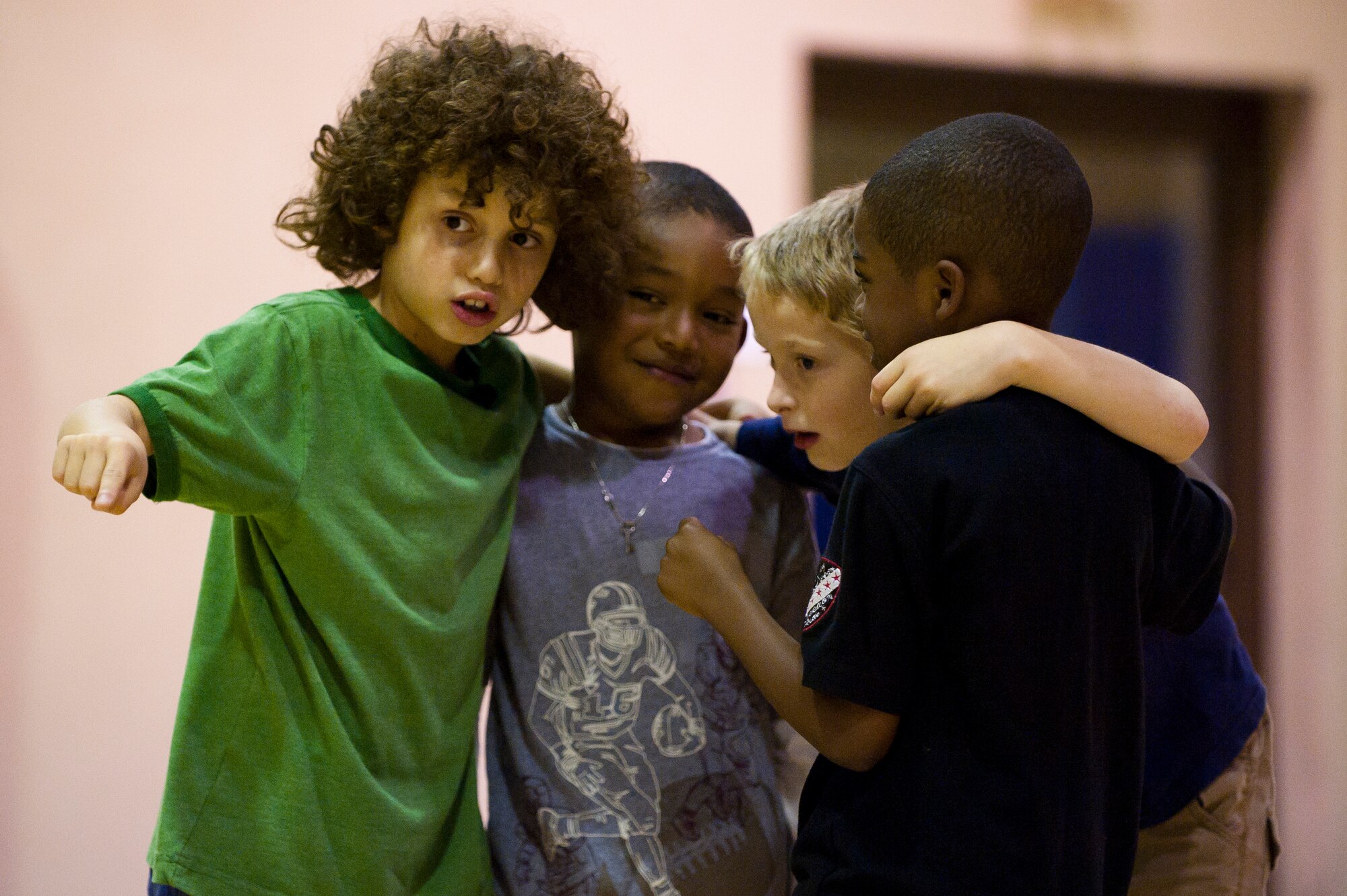 Children on defense plan a strategy during a football mini-camp Nov. 16, 2011, at Incirlik Air Base, Turkey. The camp, hosted by the youth center, was held Nov. 14-18 in lieu of the youth football season and featured instruction on a variety of techniques for beginning players. (U.S. Air Force photo by Tech. Sgt. Michael B. Keller)