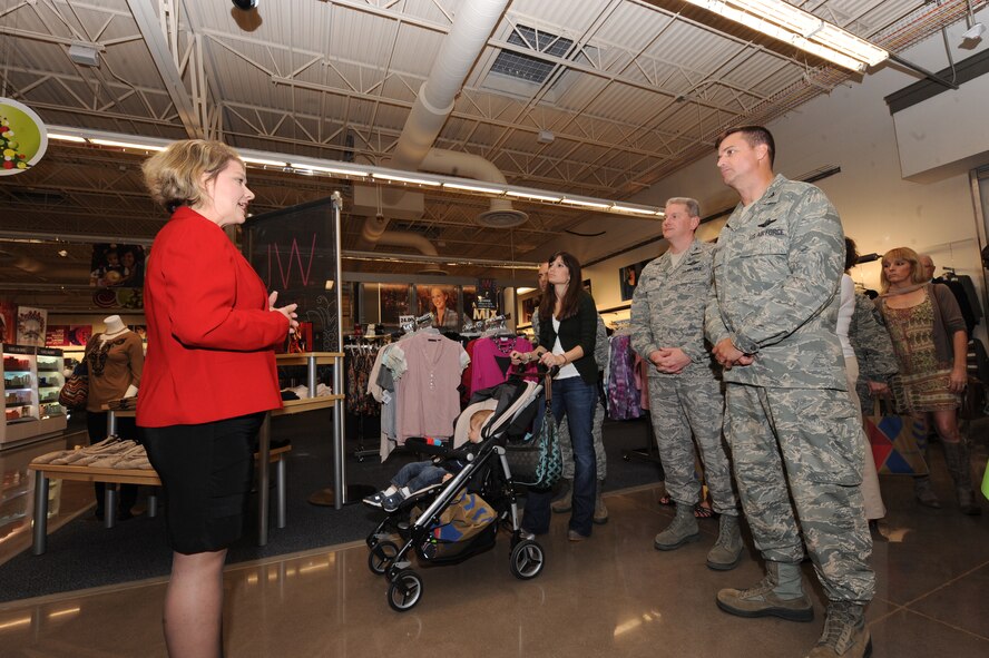 Debra O'Brien, retail exchange manager, gives special guests, including U.S. Air Force Col. Charlie Moore, 20th Fighter Wing commander and Col. Mark Moore, 9th Air Force vice commander, a tour of the new Exchange during a pre-grand opening event at Shaw Air Force Base, S.C., Nov. 16, 2011. The official ribbon cutting for the grand opening was on Nov. 17, 2011 to all Shaw personnel. The new Exchange will  replaces the oldest Exchange store in the Air Force. (U.S. Air Force photo by Airman 1st Class Tabatha Duarte/Released)
