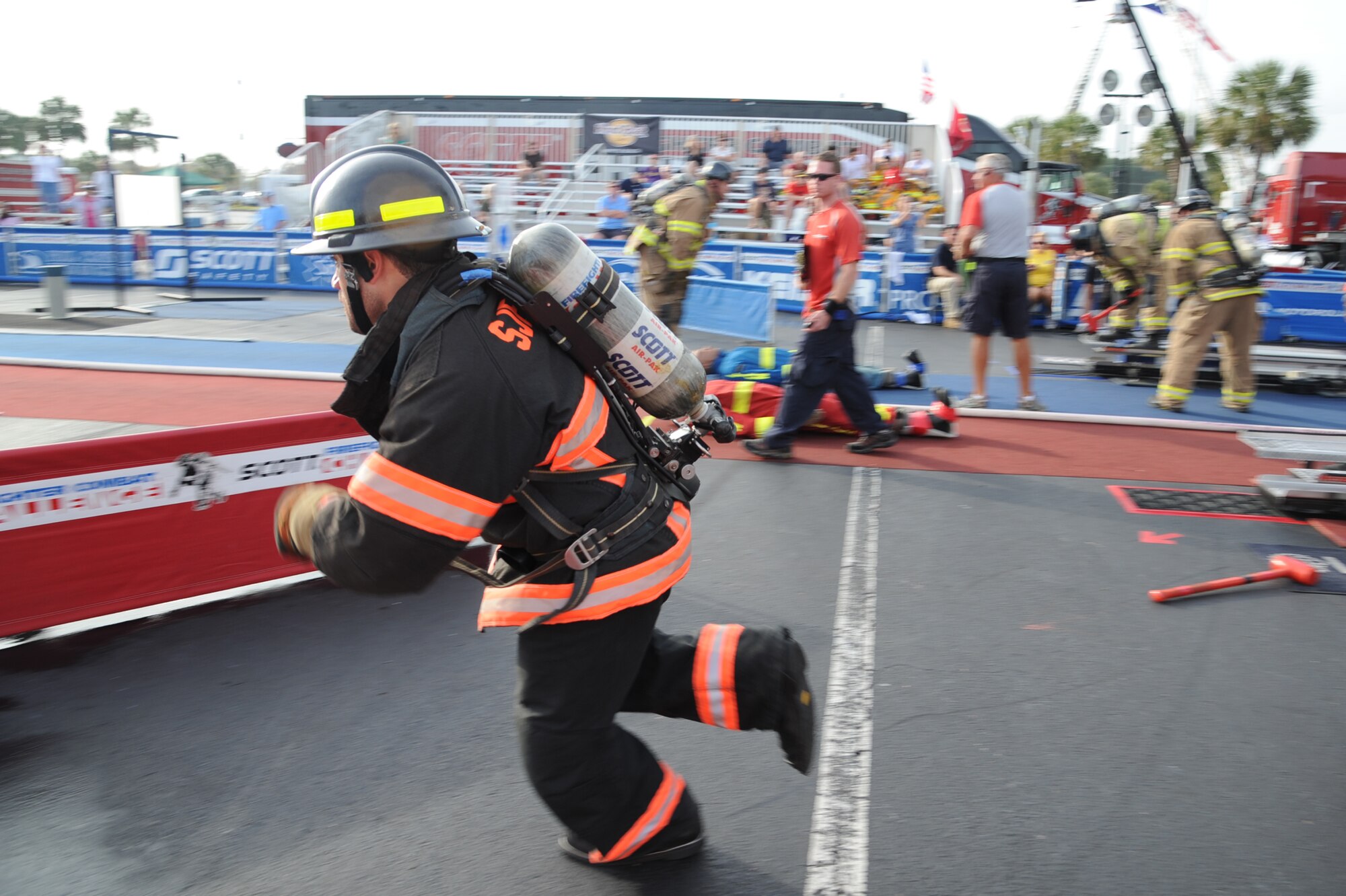 Robert Columbus, 4th Civil Engineer Squadron driver operator, navigates to an obstacle course during the Scott World Firefighter Combat Challenge in Myrtle Beach, S.C., Nov. 15, 2011. The first firefighter challenge tested the physical demands of a firefighter. Prince William County, Va., firefighters won the first challenge in 1991. Columbus hails from Pittsburgh. (U.S. Air Force photo by Senior Airman Whitney Stanfield)