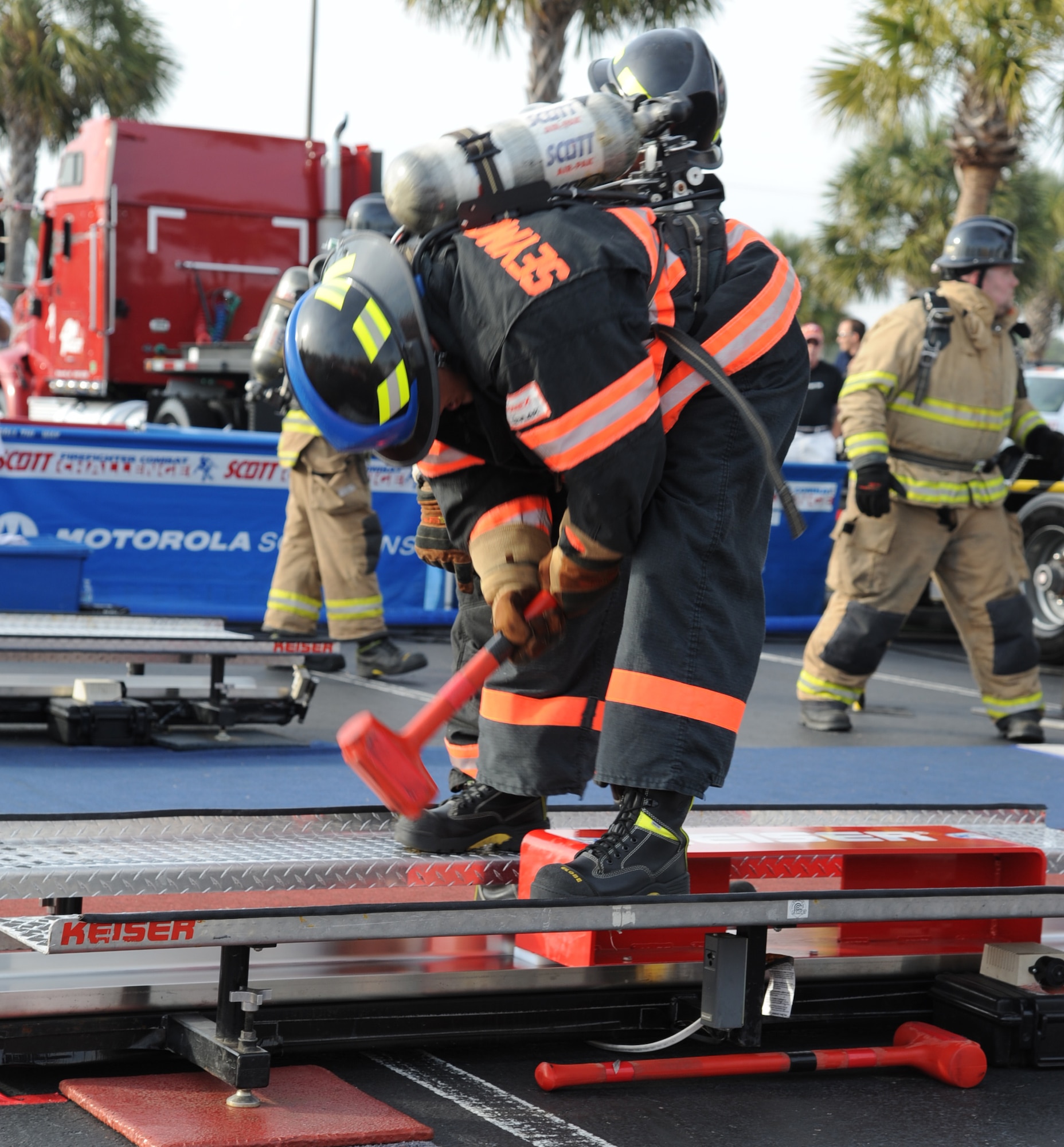 Staff Sgt. Skipper Valentin-Cruzado, 4th Civil Engineer Squadron fire inspector, swings at a 165 pound railroad tie during the Scott World Firefighter Combat Challenge in Myrtle Beach, S.C., Nov. 15, 2011. The challenge is open to all firefighters, military and civilians, across the world. Valentin-Cruzado hails from Puerto Rico. (U.S. Air Force photo by Senior Airman Whitney Stanfield)