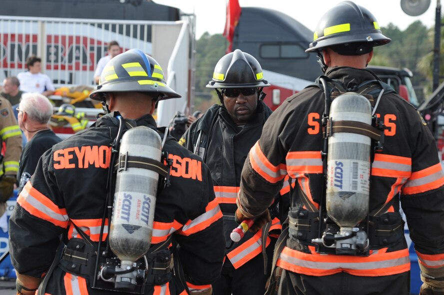 Marcus Shepard, 4th Civil Engineer Squadron lead firefighter, motivates team members before a relay race during the Scott World Firefighter Combat Challenge in Myrtle Beach, S.C., Nov. 15, 2011. Firefighters have to qualify in regionals in order to enter the world challenge.  Sheppard hails from Goldsboro, N.C. (U.S. Air Force photo by Senior Airman Whitney Stanfield)