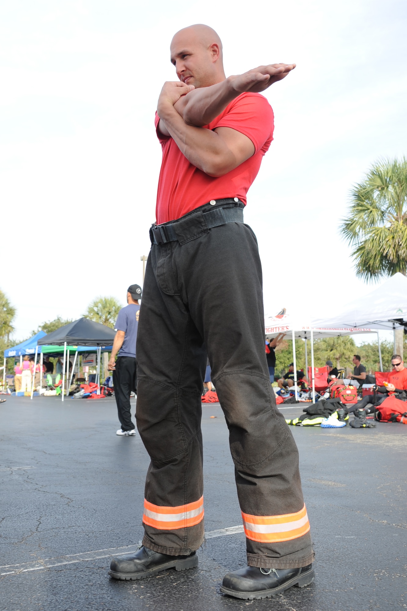 Staff Sgt. Aaron Shields, 4th Civil Engineer Squadron firefighter crew chief, stretches before participating in the Scott World Firefighter Combat Challenge in Myrtle Beach, S.C., Nov. 15, 2011. The challenge is designed to simulate the physical demands of real-life firefighting. Shields is a native of Cedar Rapids, Iowa. (U.S. Air Force photo by Senior Airman Whitney Stanfield)