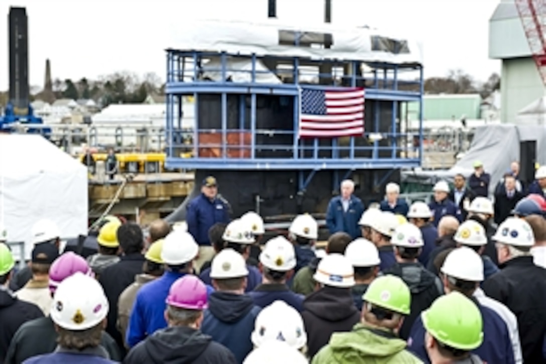 Defense Secretary Leon E. Panetta speaks to the crew and workers from General Dynamics Electric Boat in front of the Virginia-class attack submarine to be commissioned the USS Mississippi in Groton, Conn., Nov. 17, 2011. Panetta observed the final phase in the building of the submarine, which will be finished a year ahead of schedule and 15 million dollars under budget.