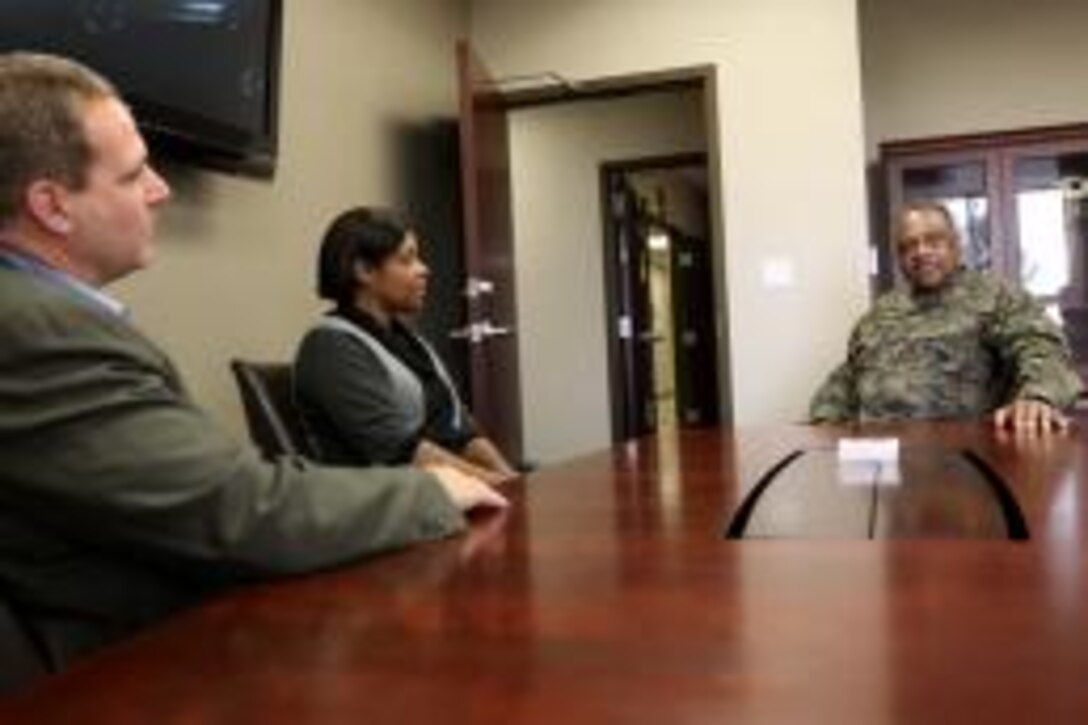California’s Energy Commissioner Carla Peterman (center) speaks with Major General Anthony L. Jackson, who at the time was commanding general of MCI-West, to discuss plans and strategies that could be taken to expand and progress in the development of renewable energy, during her visit of MCI-West, Nov. 17.::r::::n::